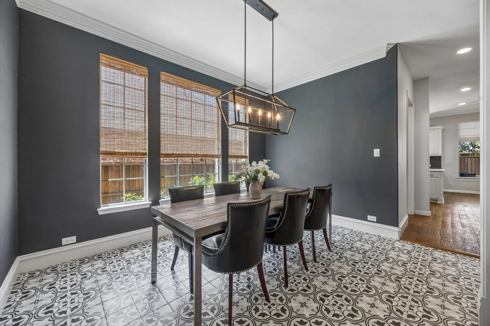Elegant dining room with updated fixtures and decorative flooring