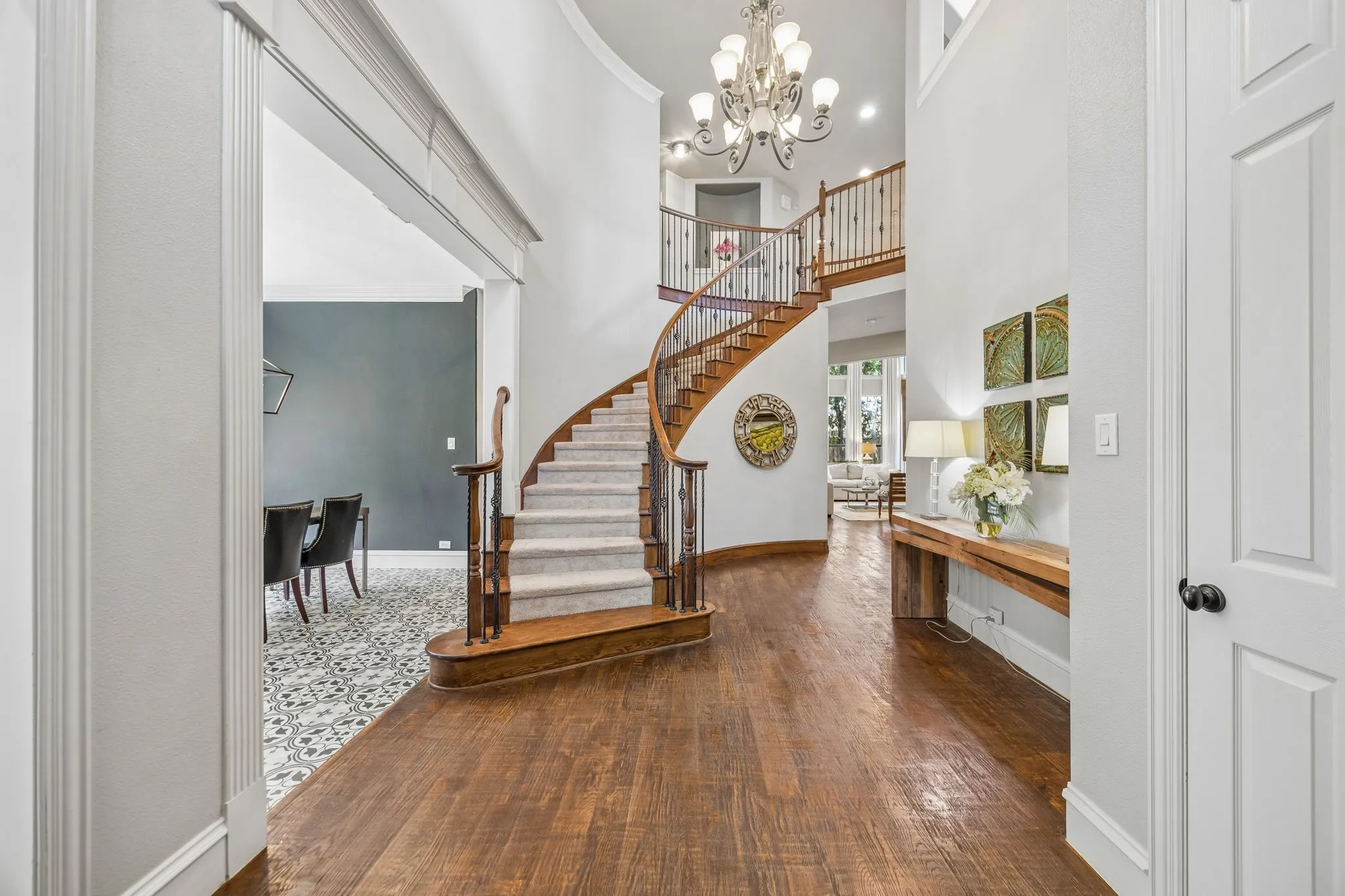 Hardwood floors and 19' ceilings greet you upon entry