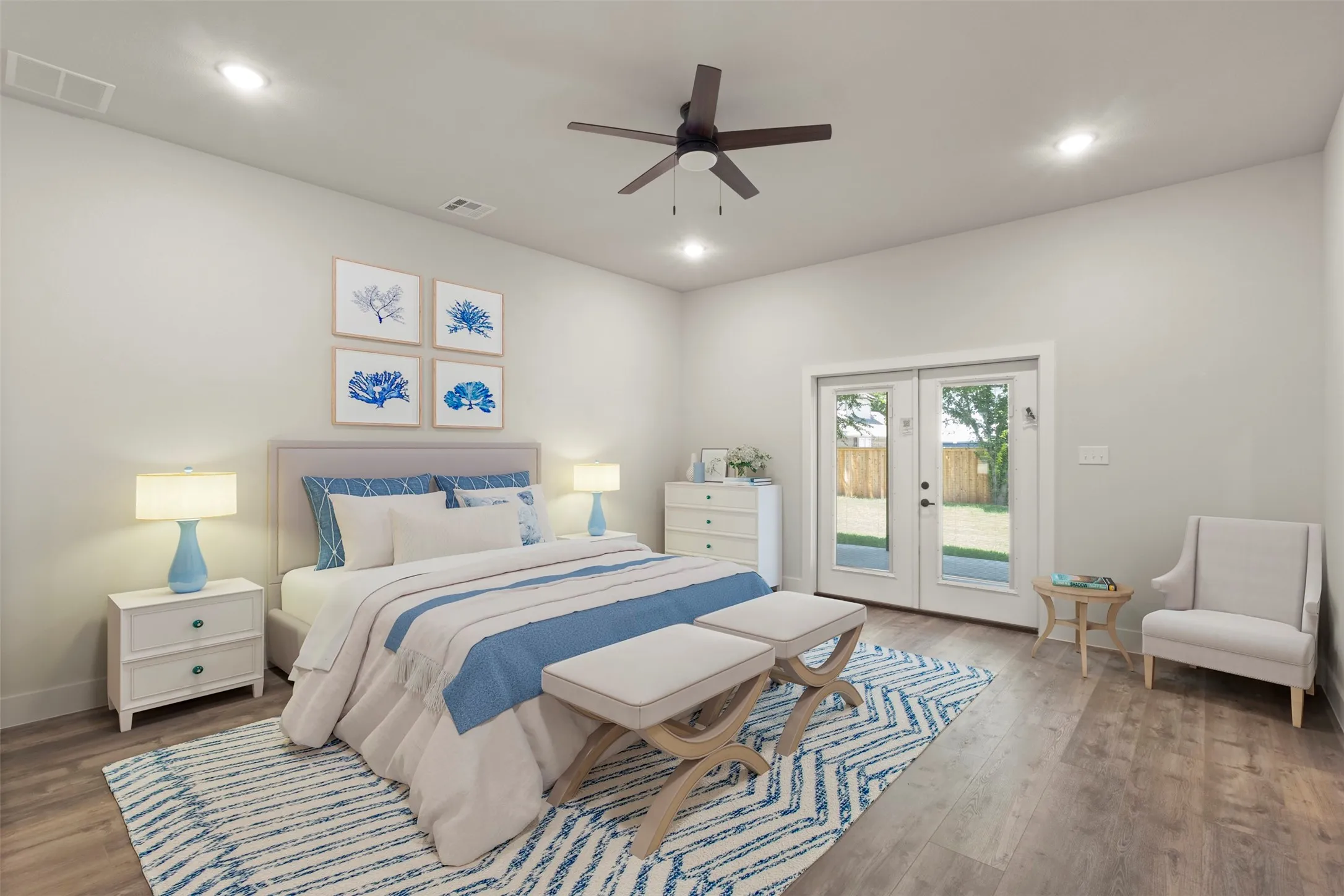 Spacious room featuring wood-finish flooring, recessed lighting, and a ceiling fan