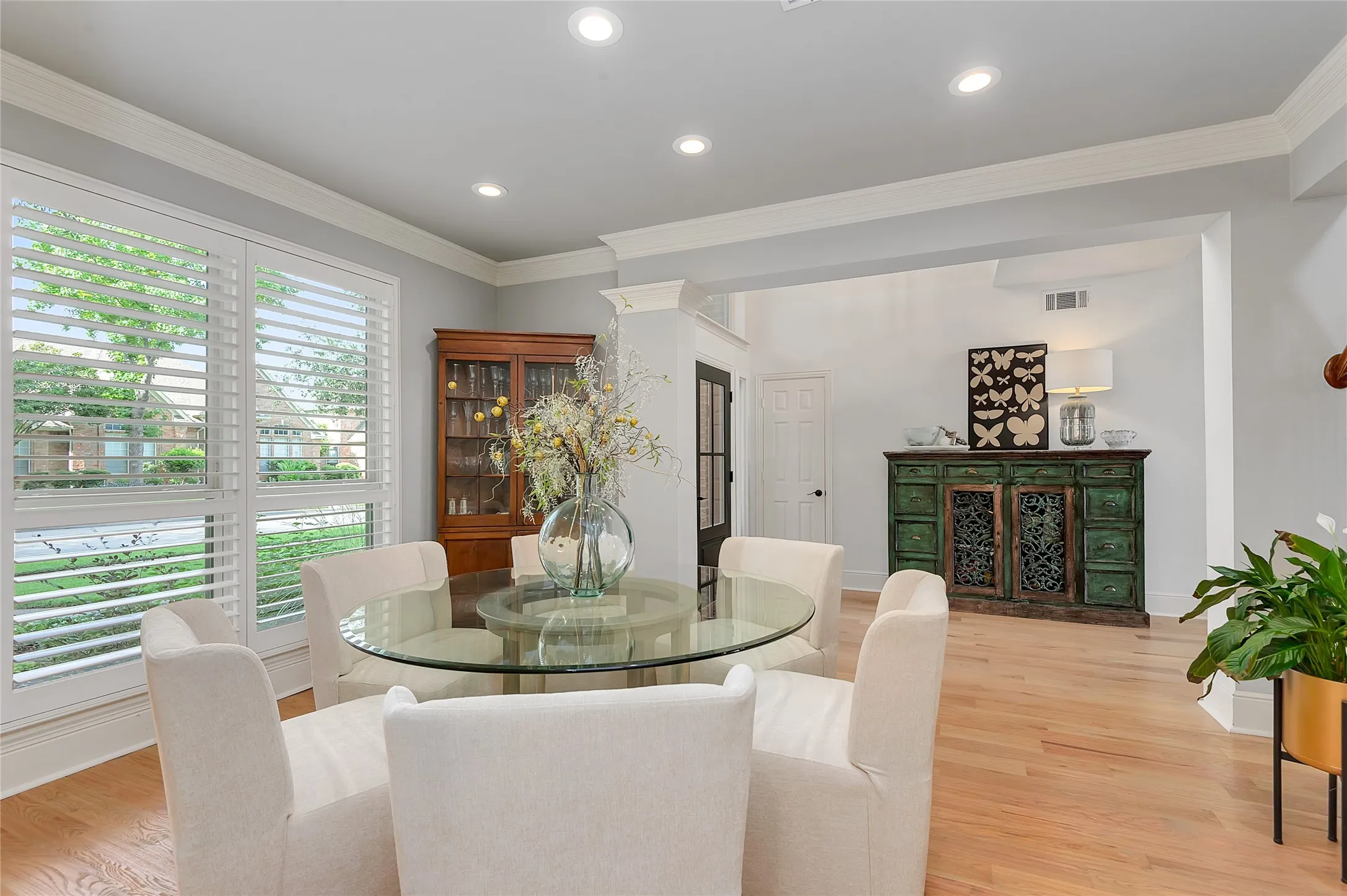 Dining area with wide plank wood-finish flooring