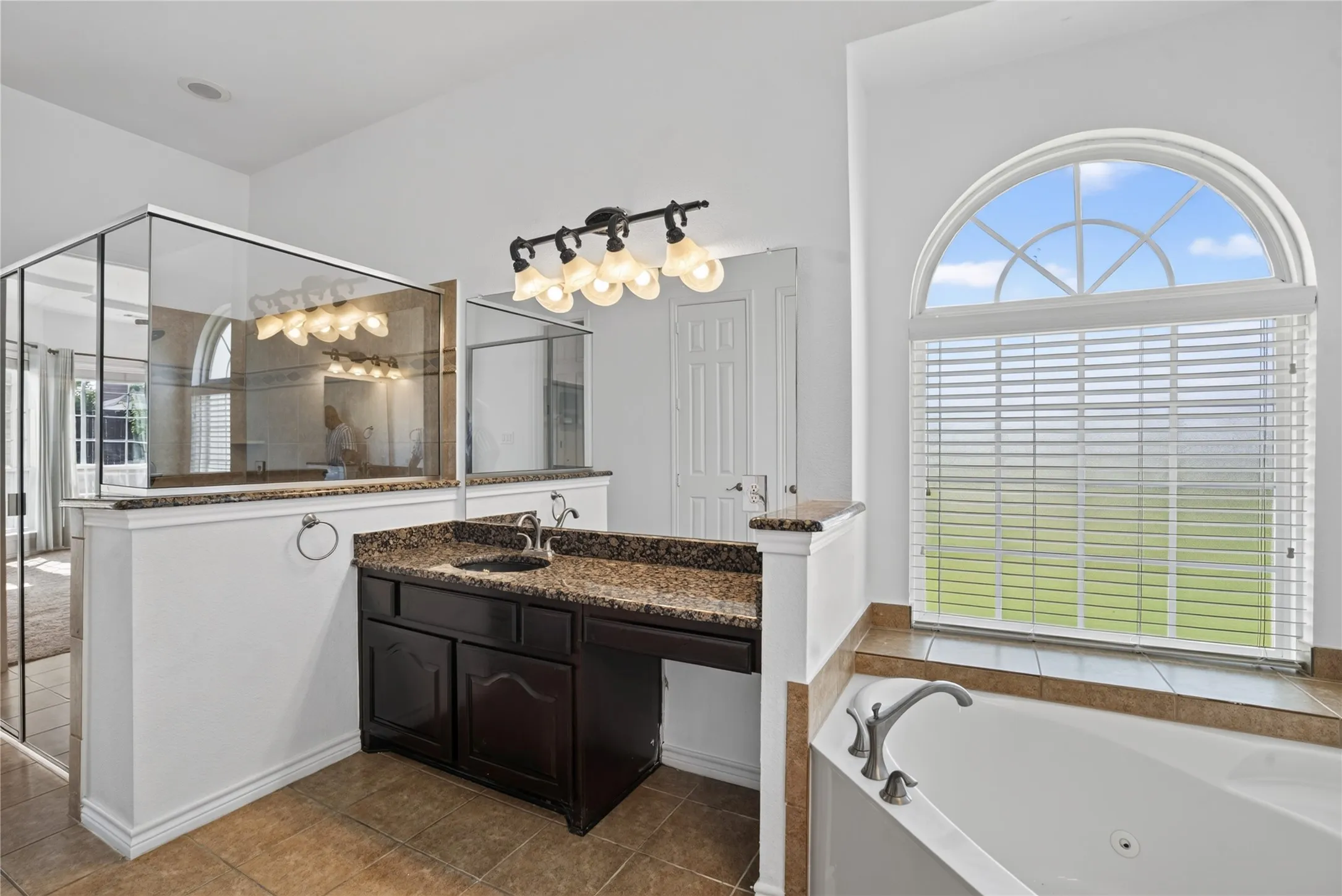 Dual sinks for his and her and vanity area and jetted bathtub!