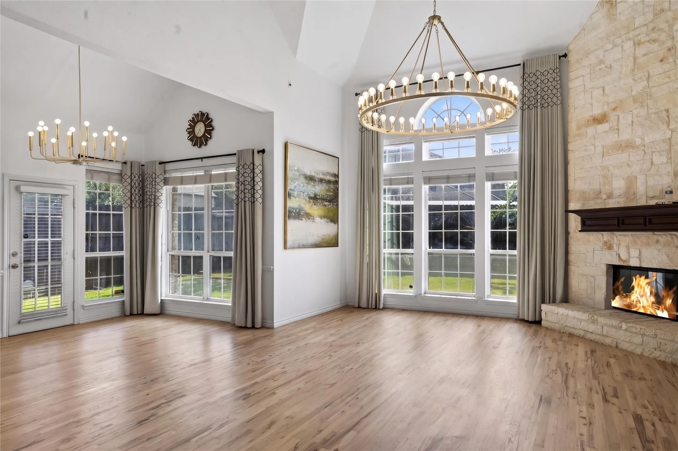 Opulent and spacious main living room! Check out the chandeliers and elegant flooring!