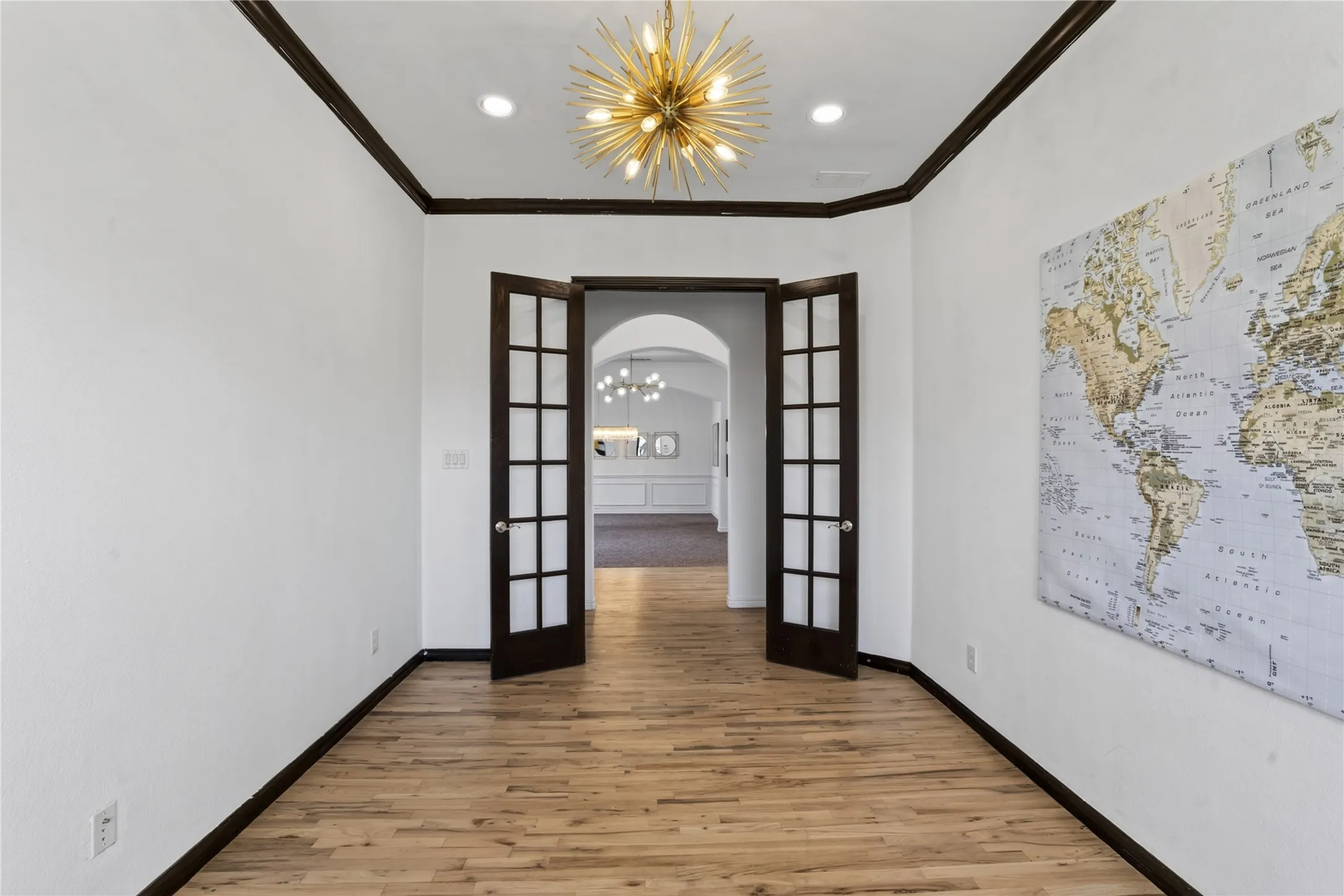 Oversized Office/study space with custom french doors and exquisite light fixutre!