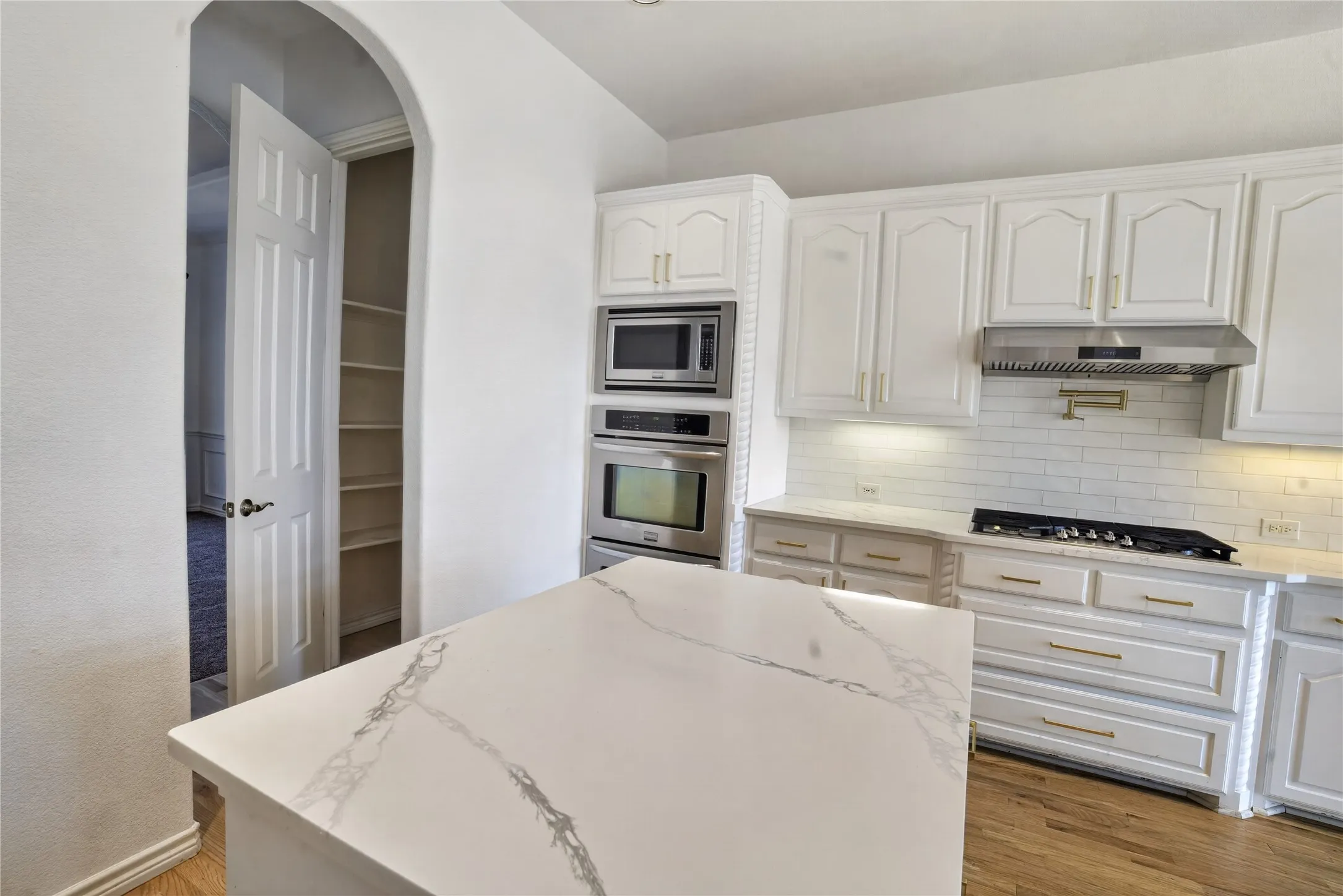 Beautiful white stone coutertops throughout the kitchen!