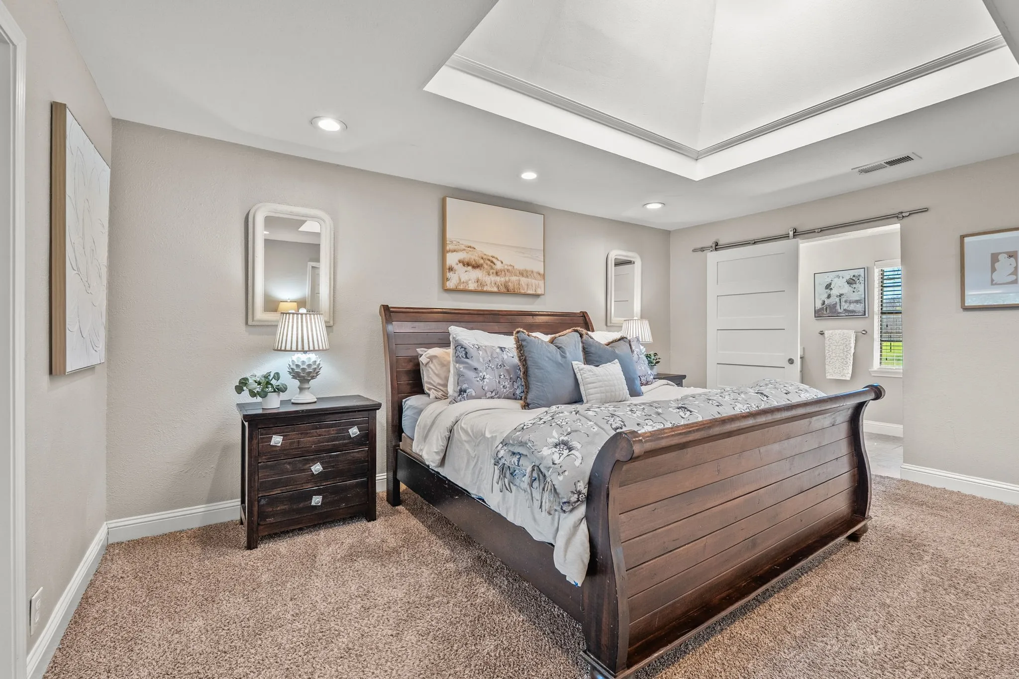 Primary bedroom with large skylight