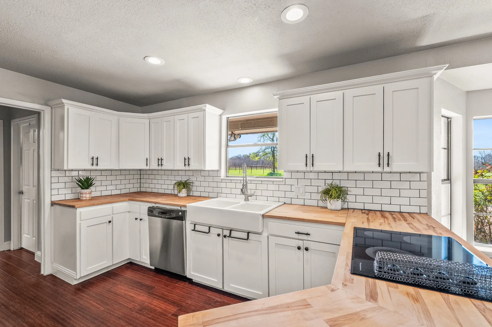 Kitchen with butcher block counters and subway tile backsplash