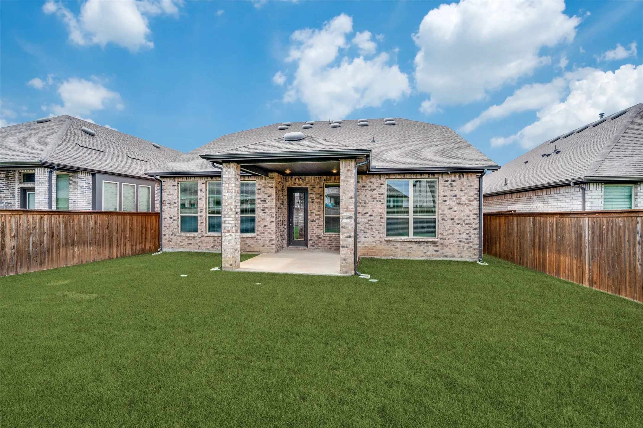 Enjoy outdoor living year-round on the covered patio overlooking the private backyard. This inviting outdoor space is perfect for morning coffee, weekend barbecues, or relaxing evenings while enjoying the Texas weather.