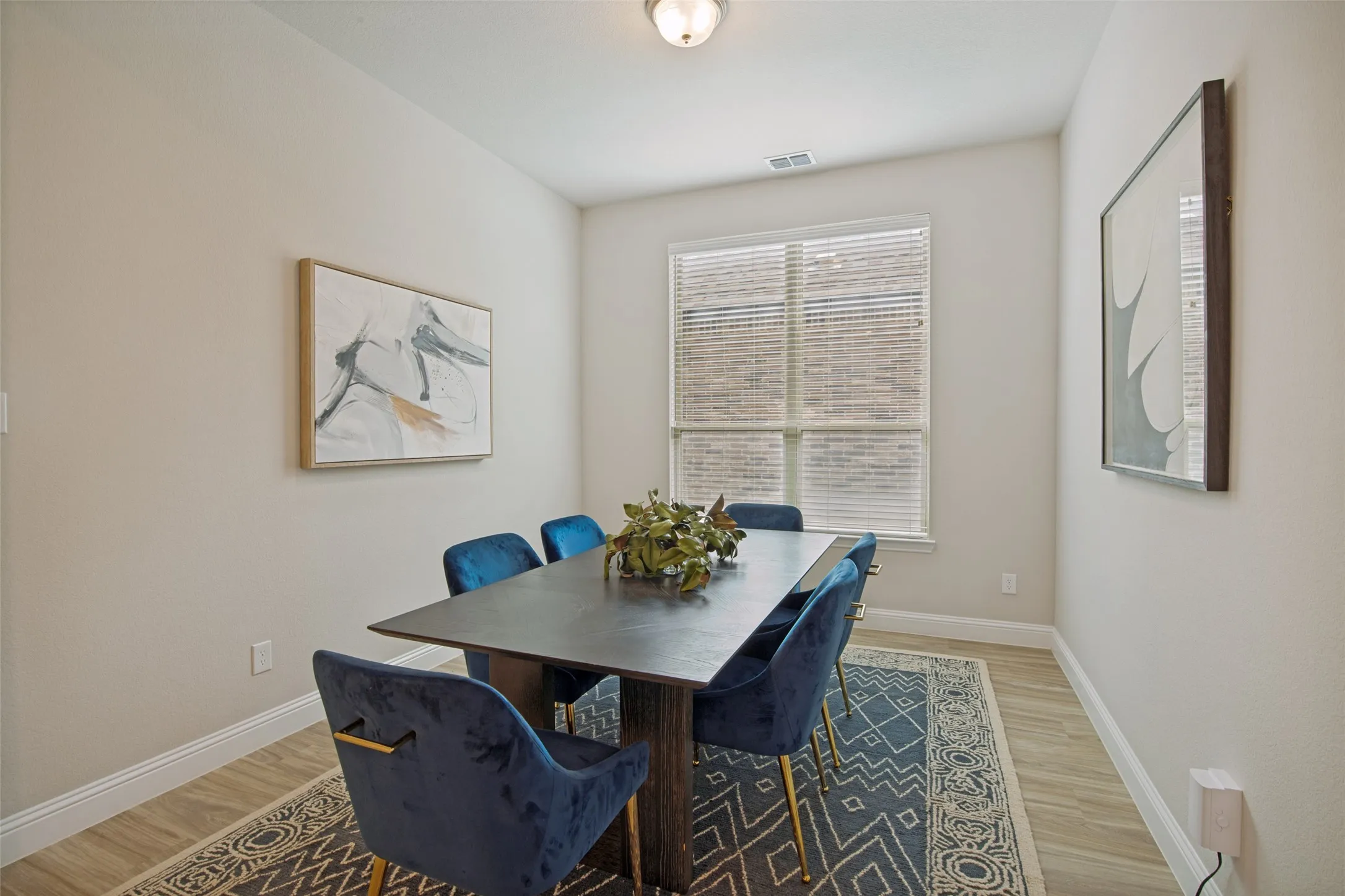 Dedicated dining room with abundant natural light, stylish designer finishes, and plenty of space for hosting family dinners or holiday gatherings.