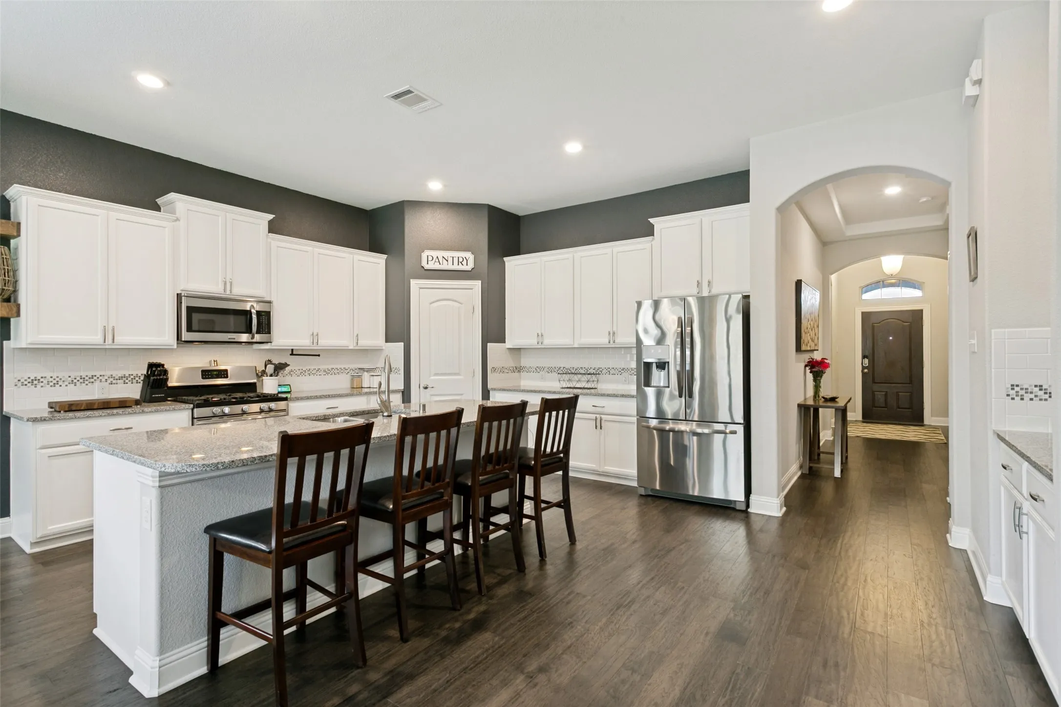 Kitchen featuring an expansive island with countertop seating