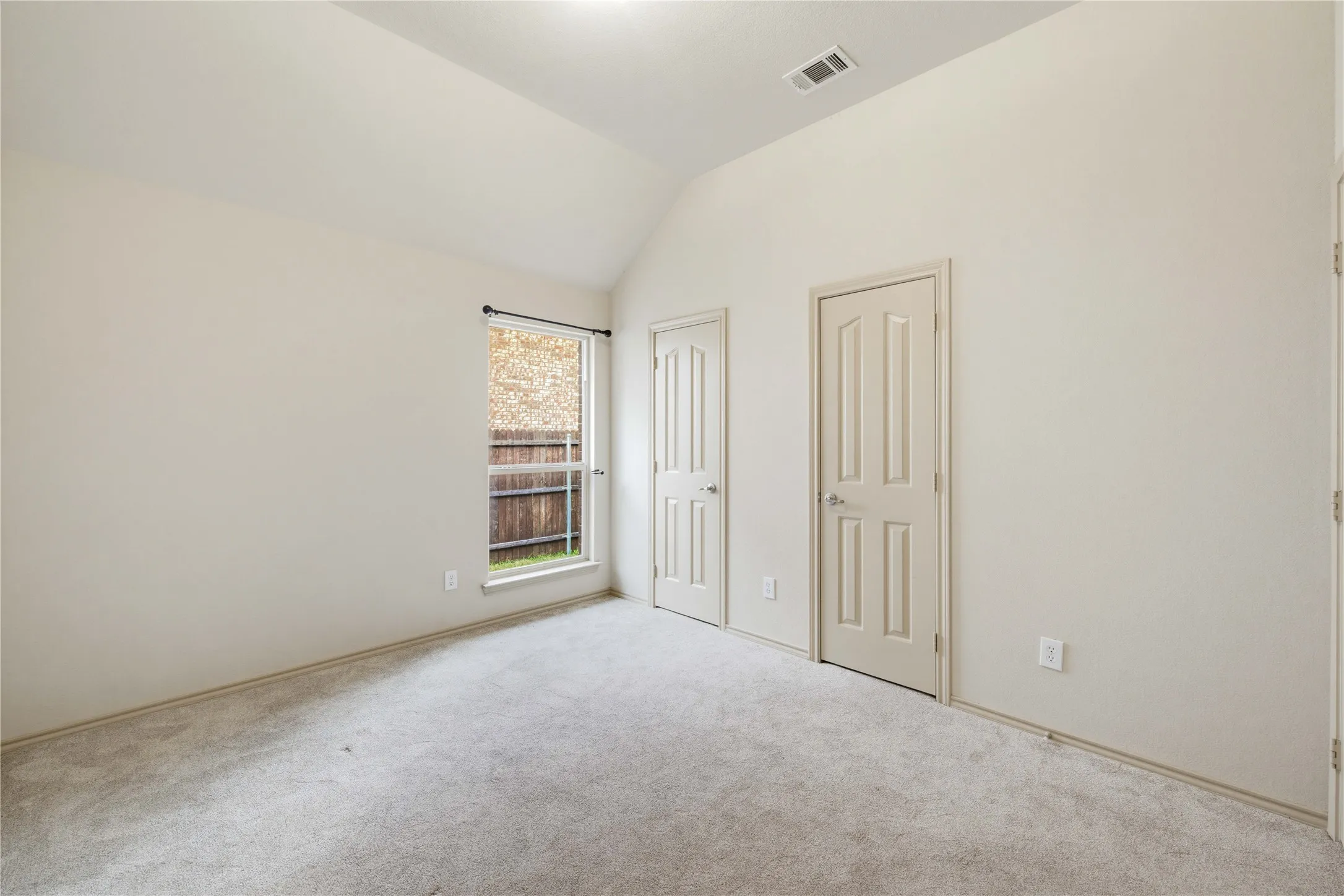 4th Bedroom with an extended closet and vaulted ceilings!