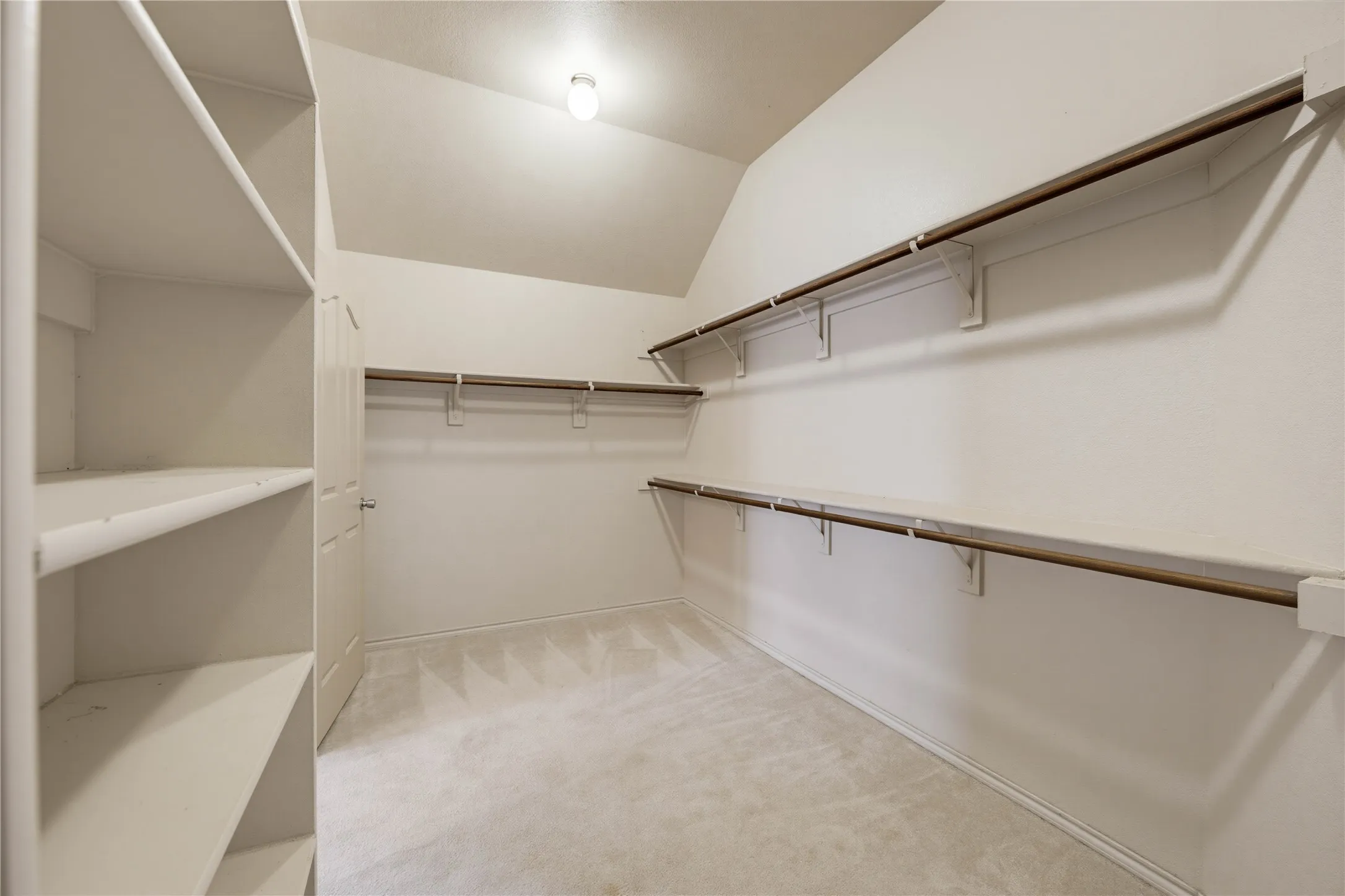 Large walk in closet in the ensuite primary bathroom.