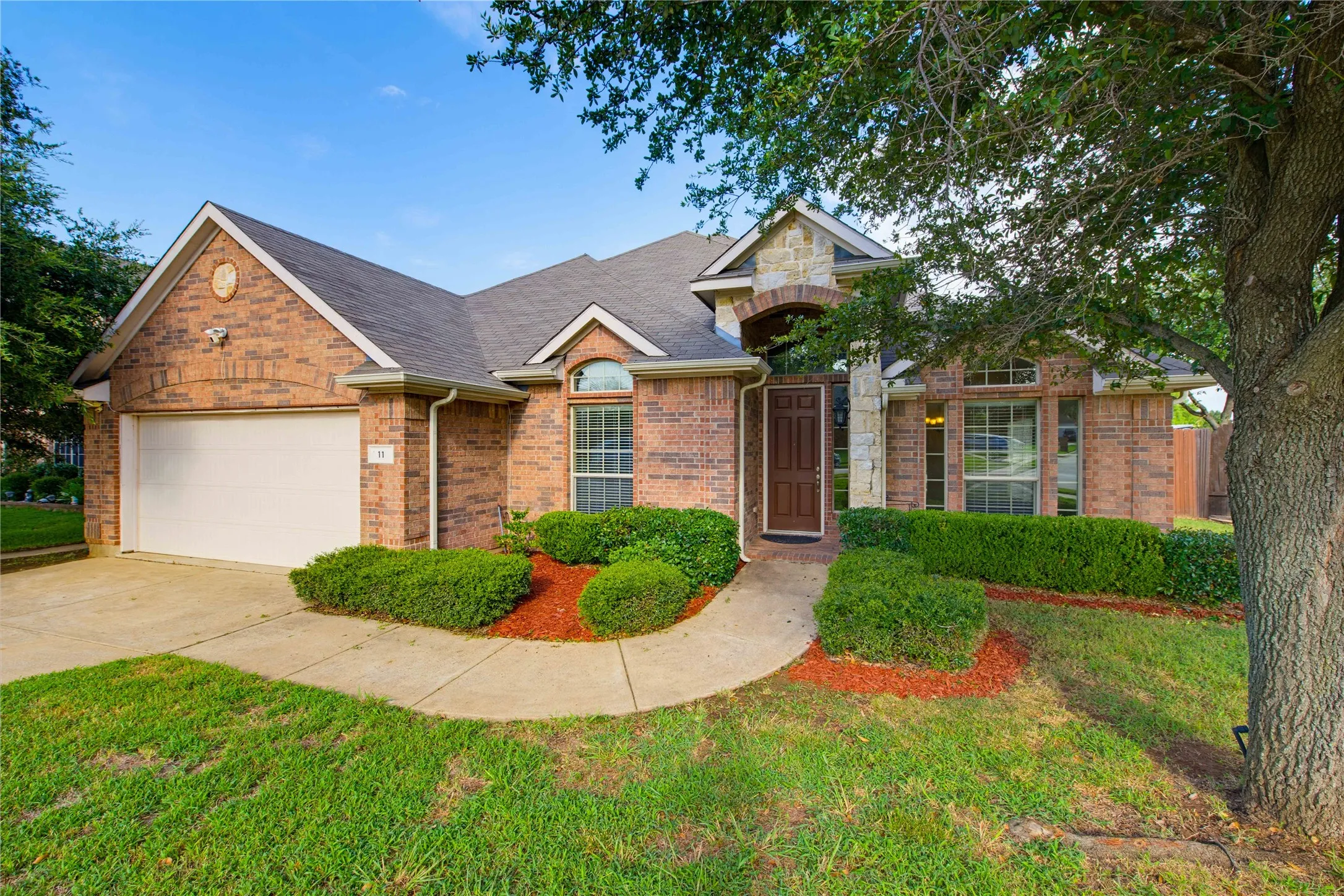Beautifully landscaped and mature trees in the front