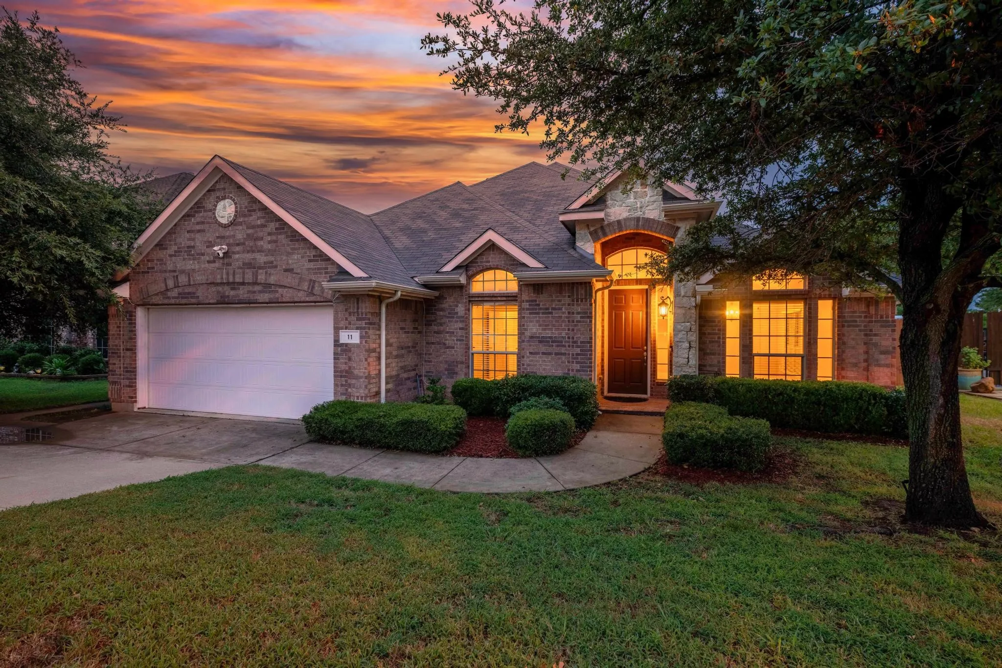 Front exterior of the home listed for sale at 11 Beechcreek Drive, Edgecliff Village, TX 76134, near Fort Worth in Tarrant County. The photograph shows the home's front facade and entrance.