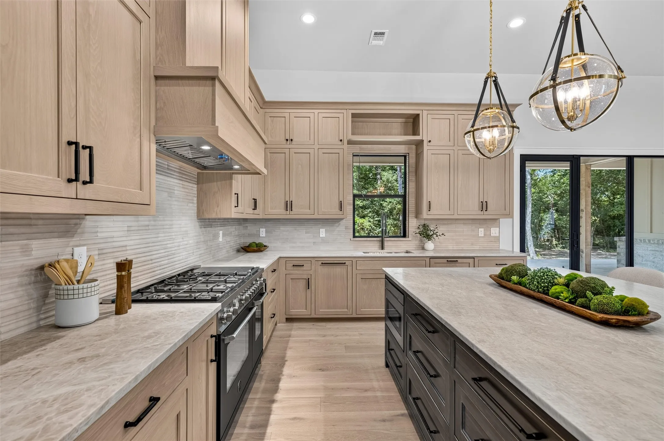 Large gas range with double oven and an abundance of storage space.