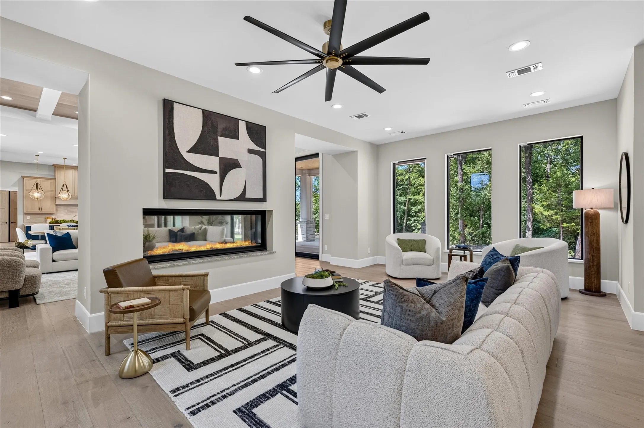Family room features stunning shared, see through fireplace with living room.