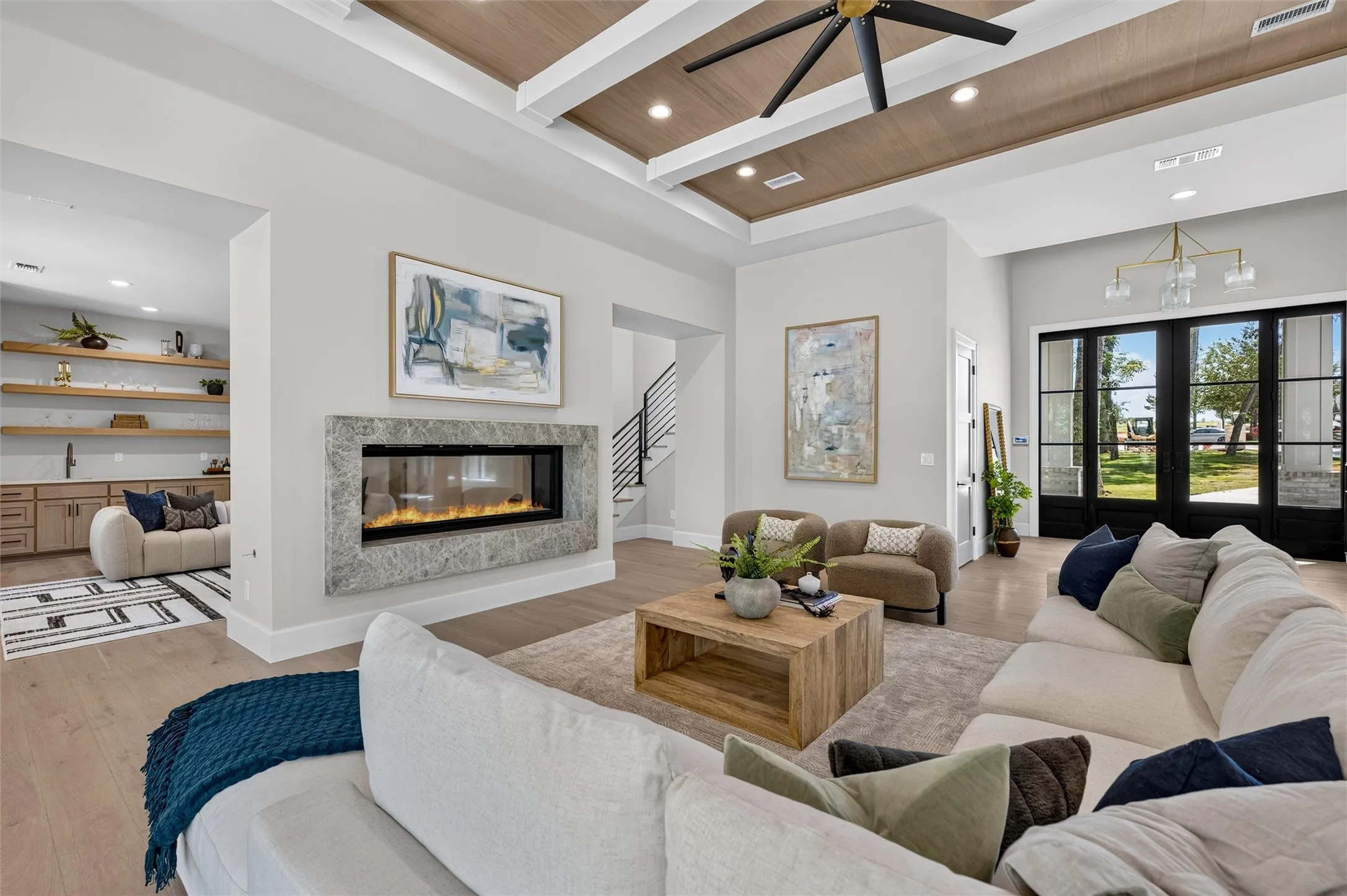 Living room features custom ceiling design.