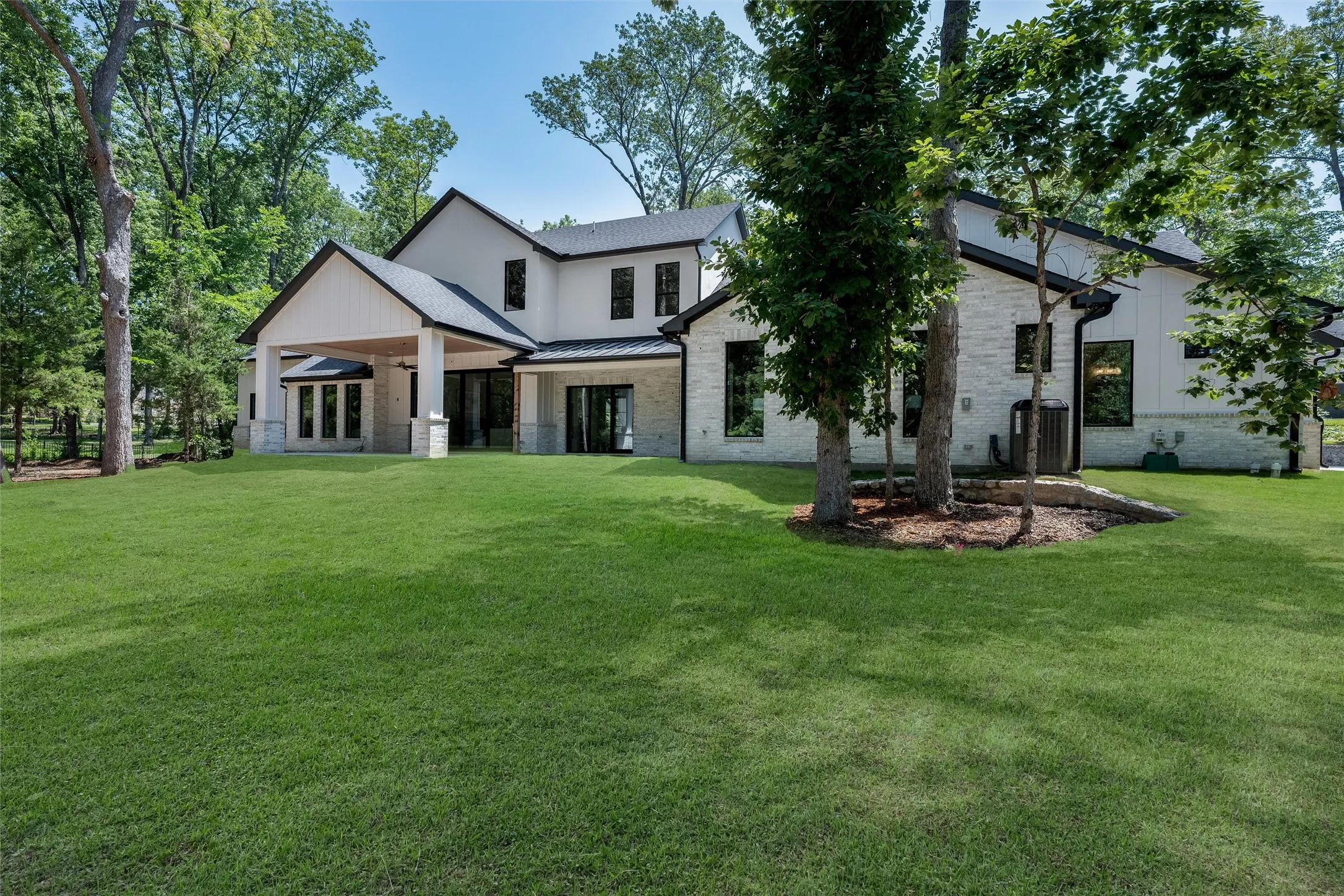 Lush, wooded lot provides beautiful views of nature.