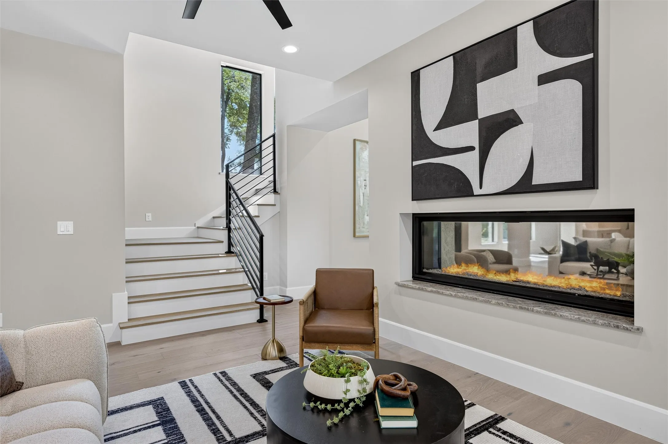 Wide staircase from the family room to second floor.