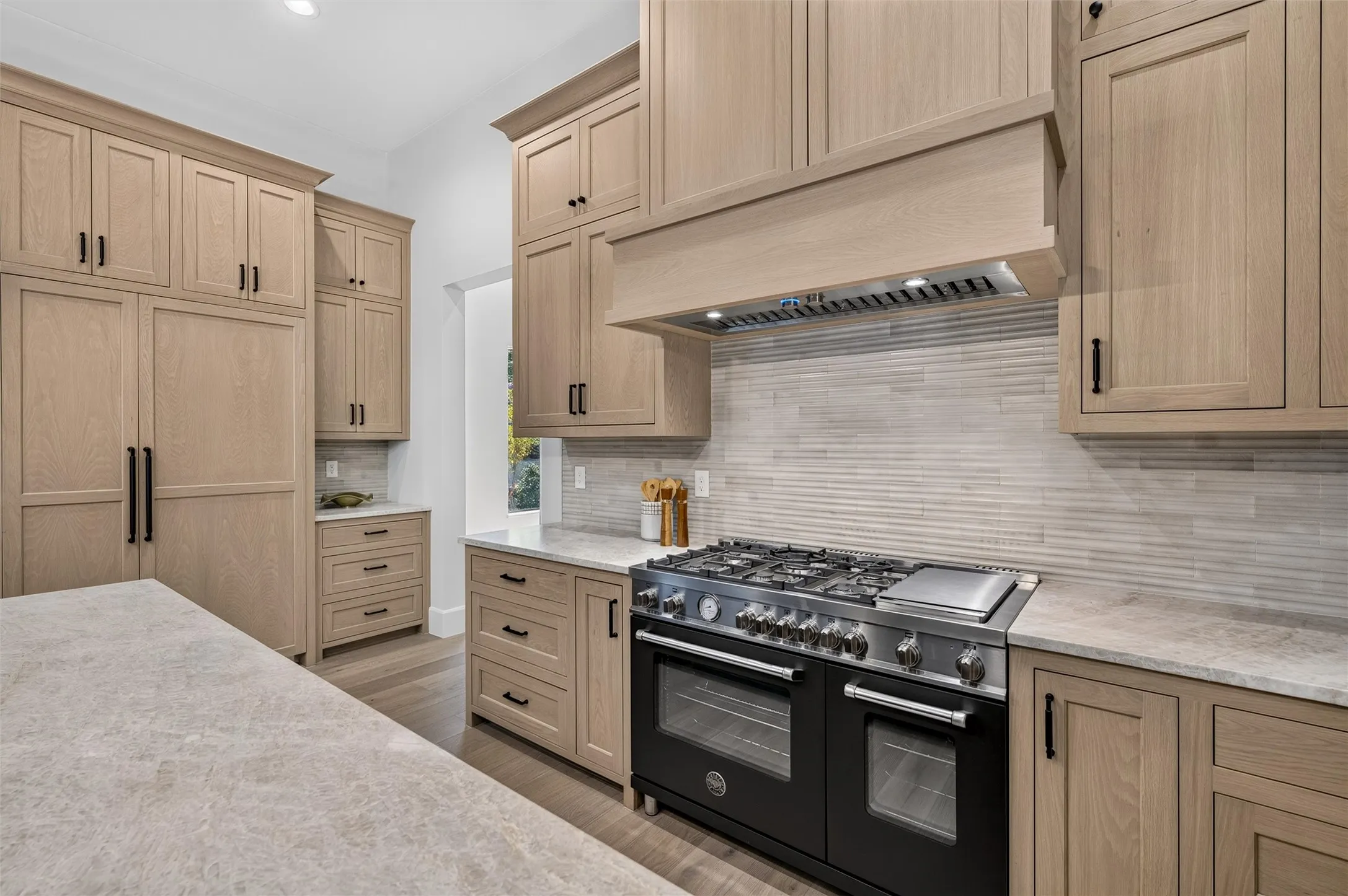 Custom built in refrigerator matches cabinetry.