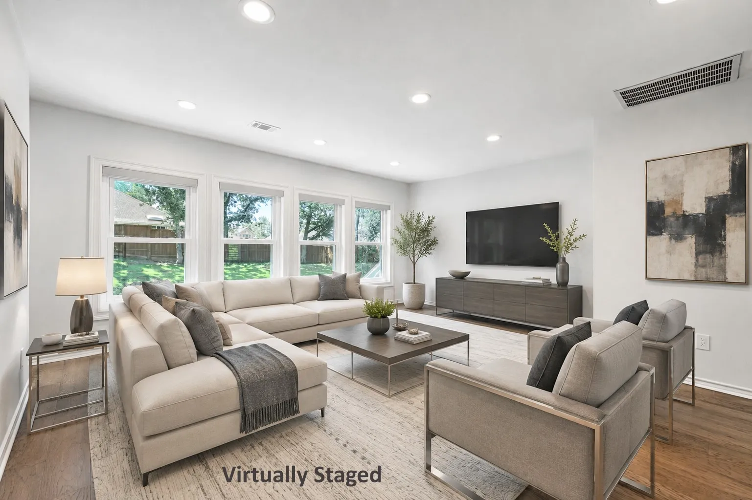 Virtually Staged: Living area featuring hardwood flooring and recessed lighting