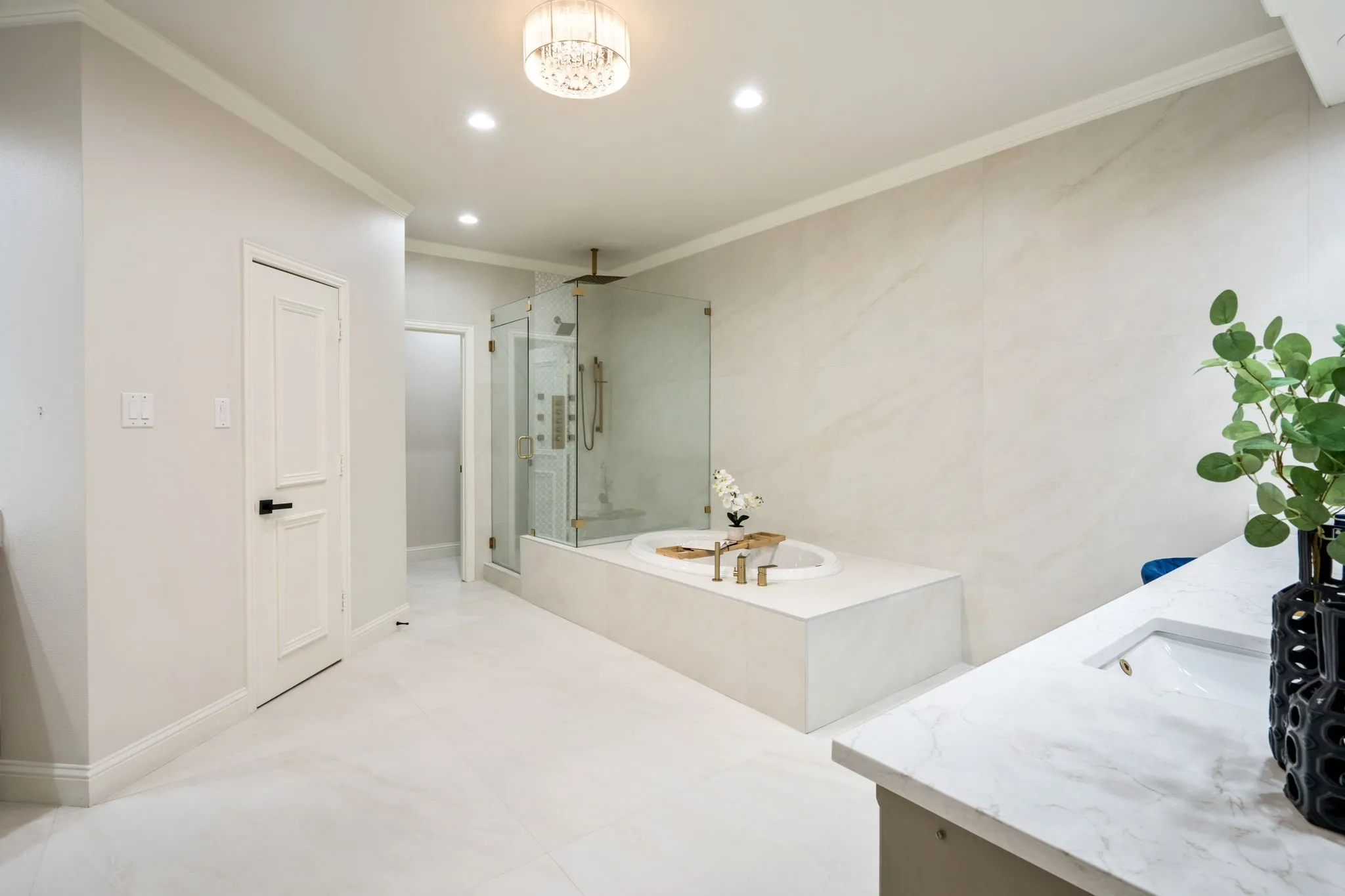 Full bath featuring ornamental molding, a garden tub, a marble finish shower, recessed lighting, and vanity
