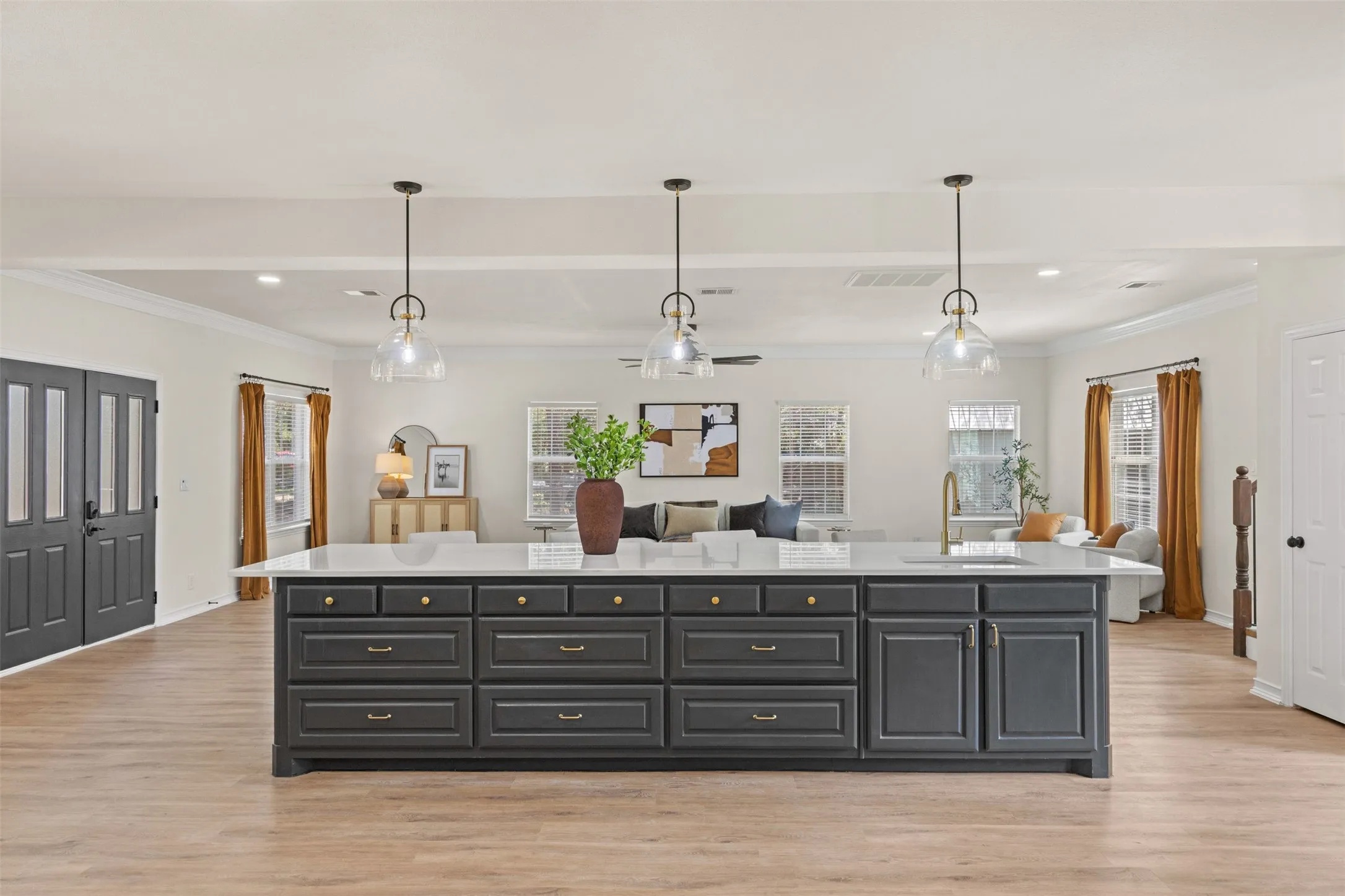 The heart of the home: Fully renovated kitchen featuring an oversized island with second full size sink for food prep