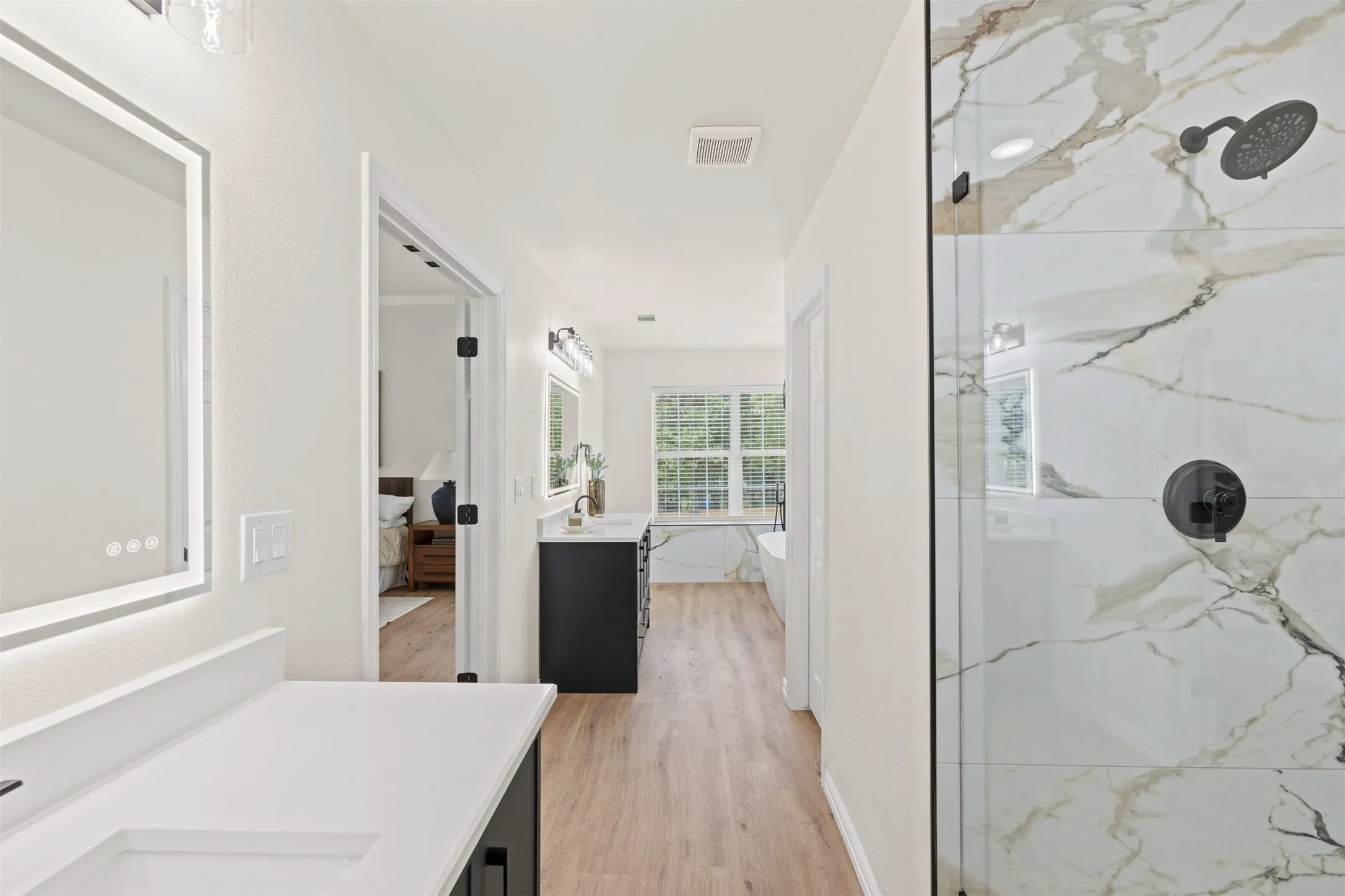 Primary bathroom with dual vanity and soak tub