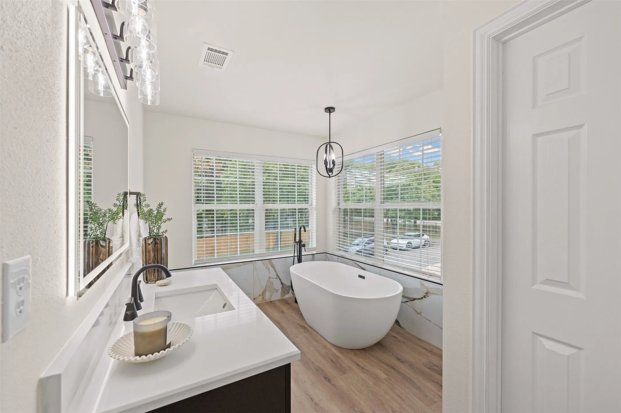 Primary bathroom with dual vanity and soak tub