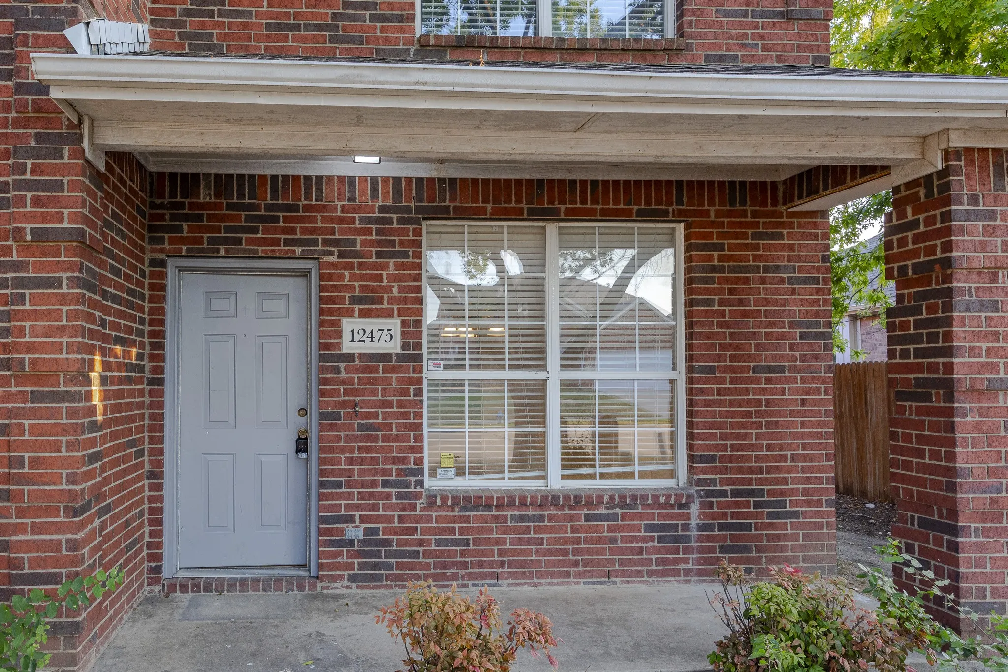 Brick exterior with a covered entry