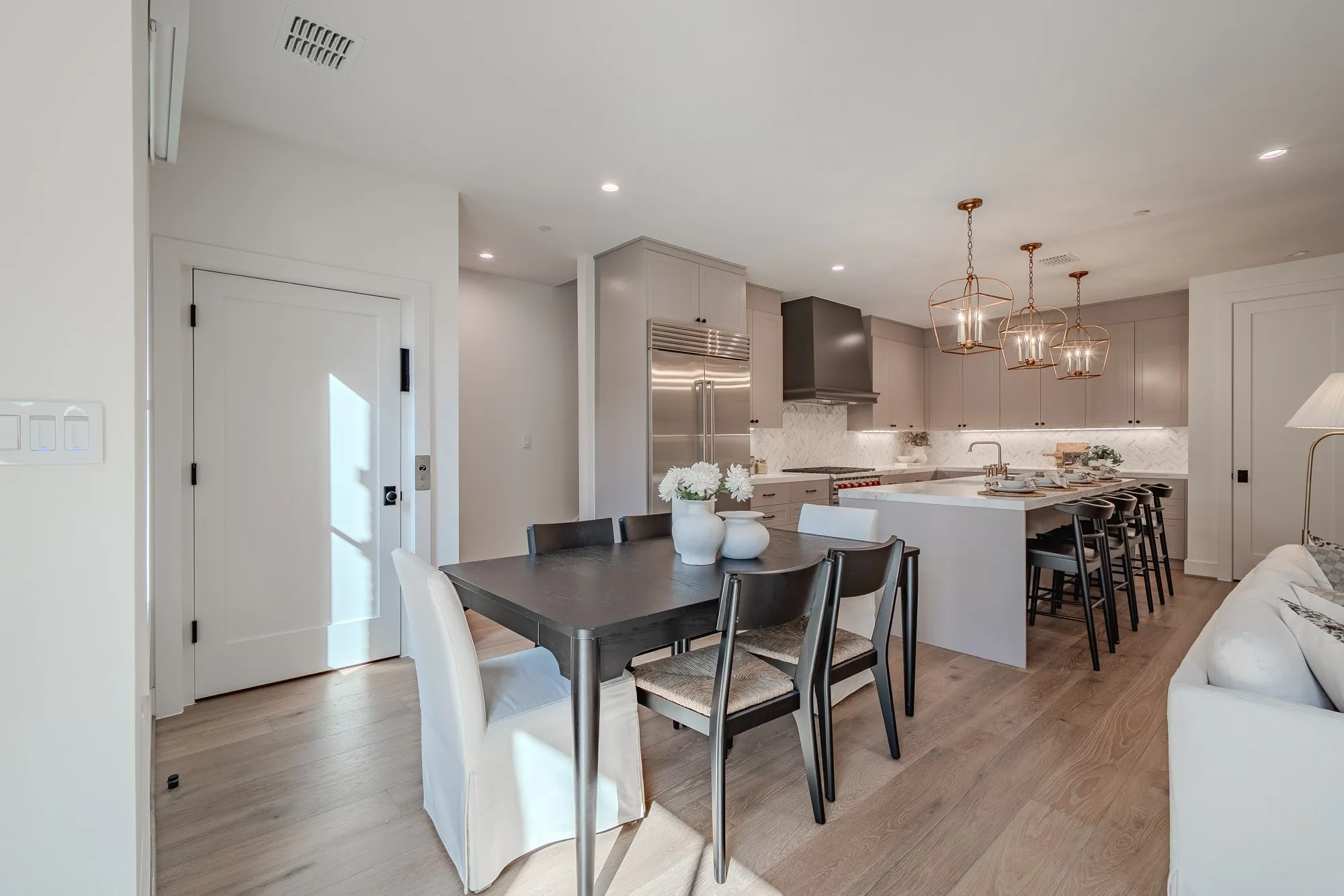 Dining room featuring light wood finished floors, a chandelier, and recessed lighting
