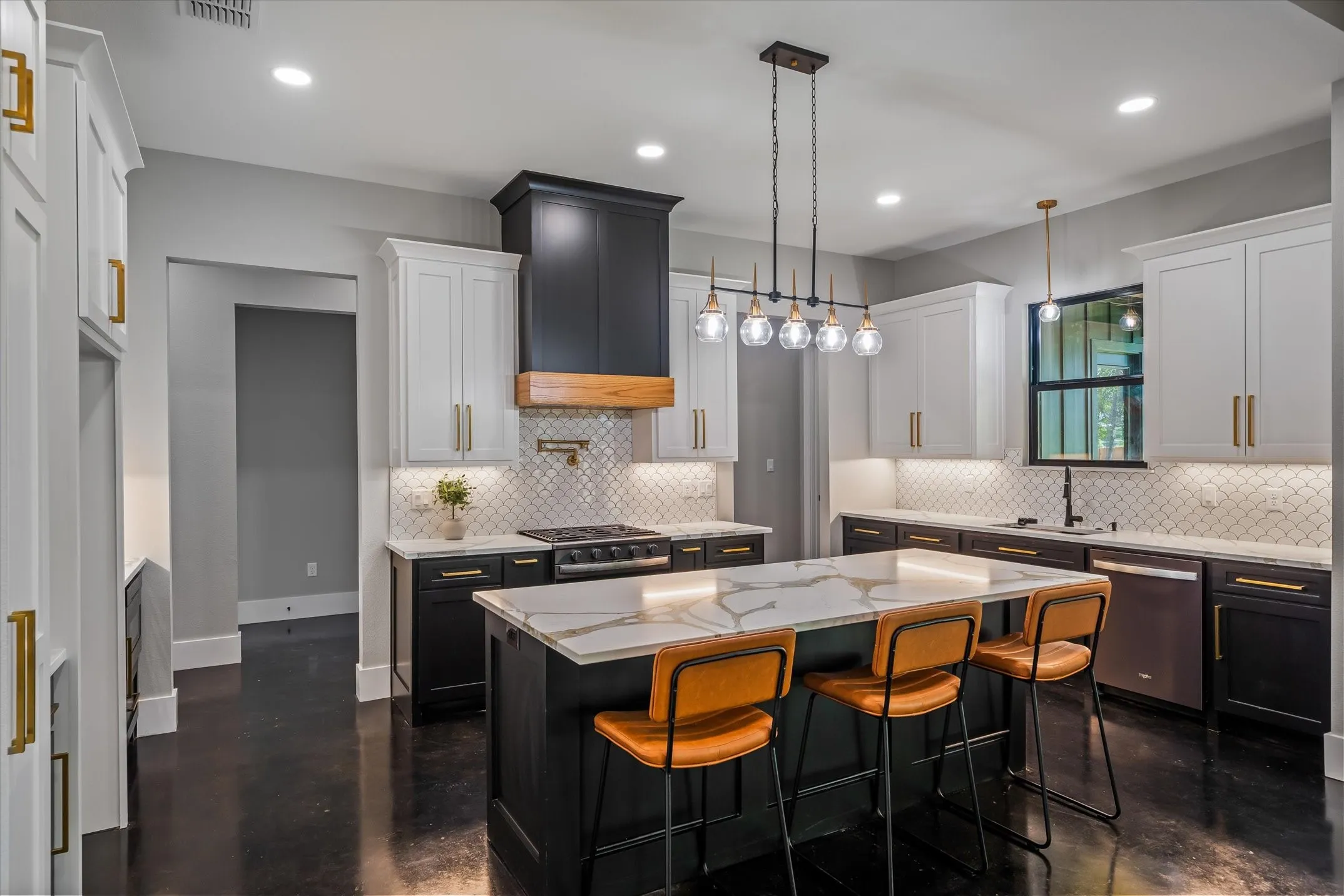 Kitchen featuring a large island with a patterned countertop, two-tone cabinetry, a tile backsplash, dark wood-finish flooring, and recessed lighting