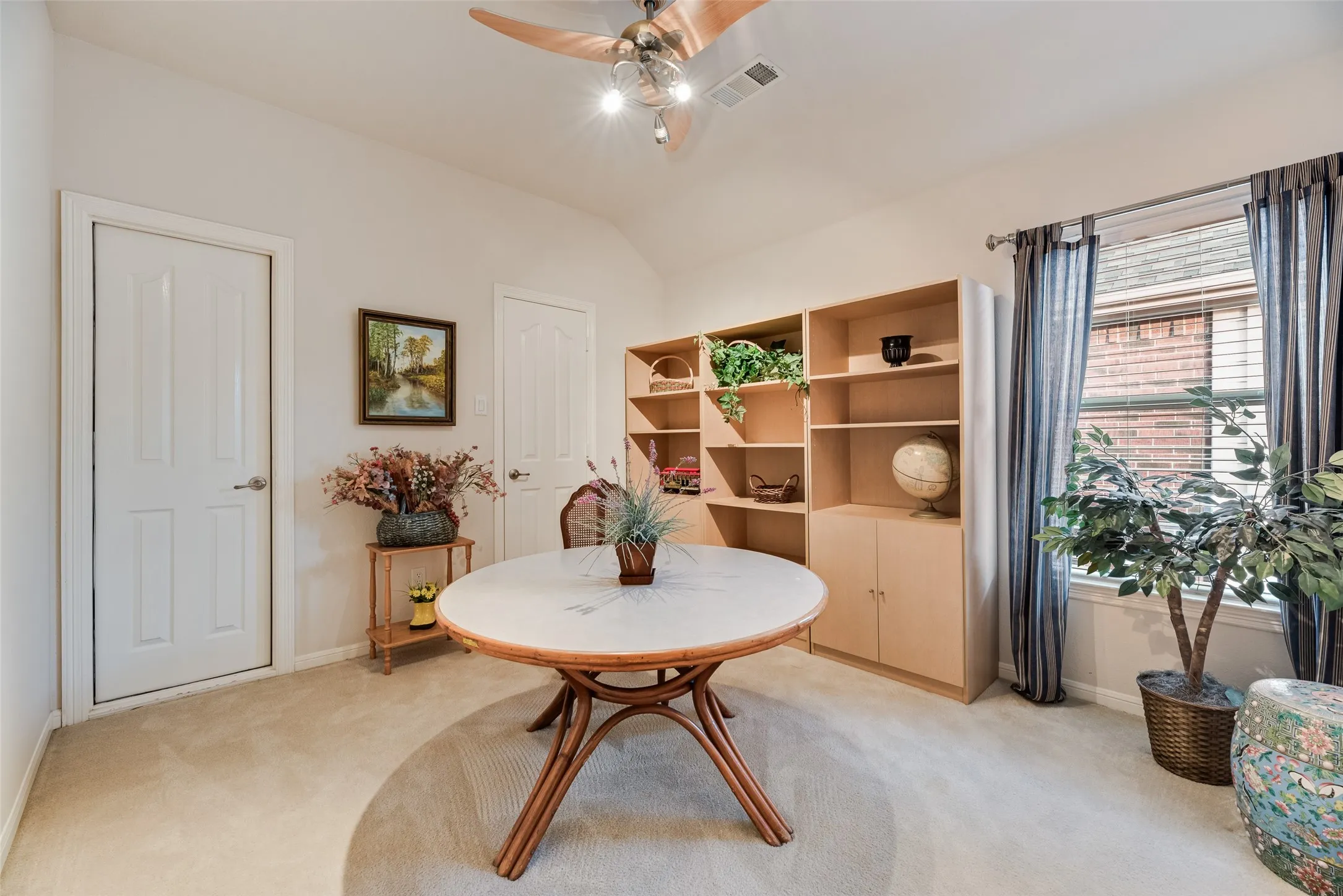 Bedroom five being used as a craft or game space. It has a nice walk-in closet as well as access to storage in the attic.