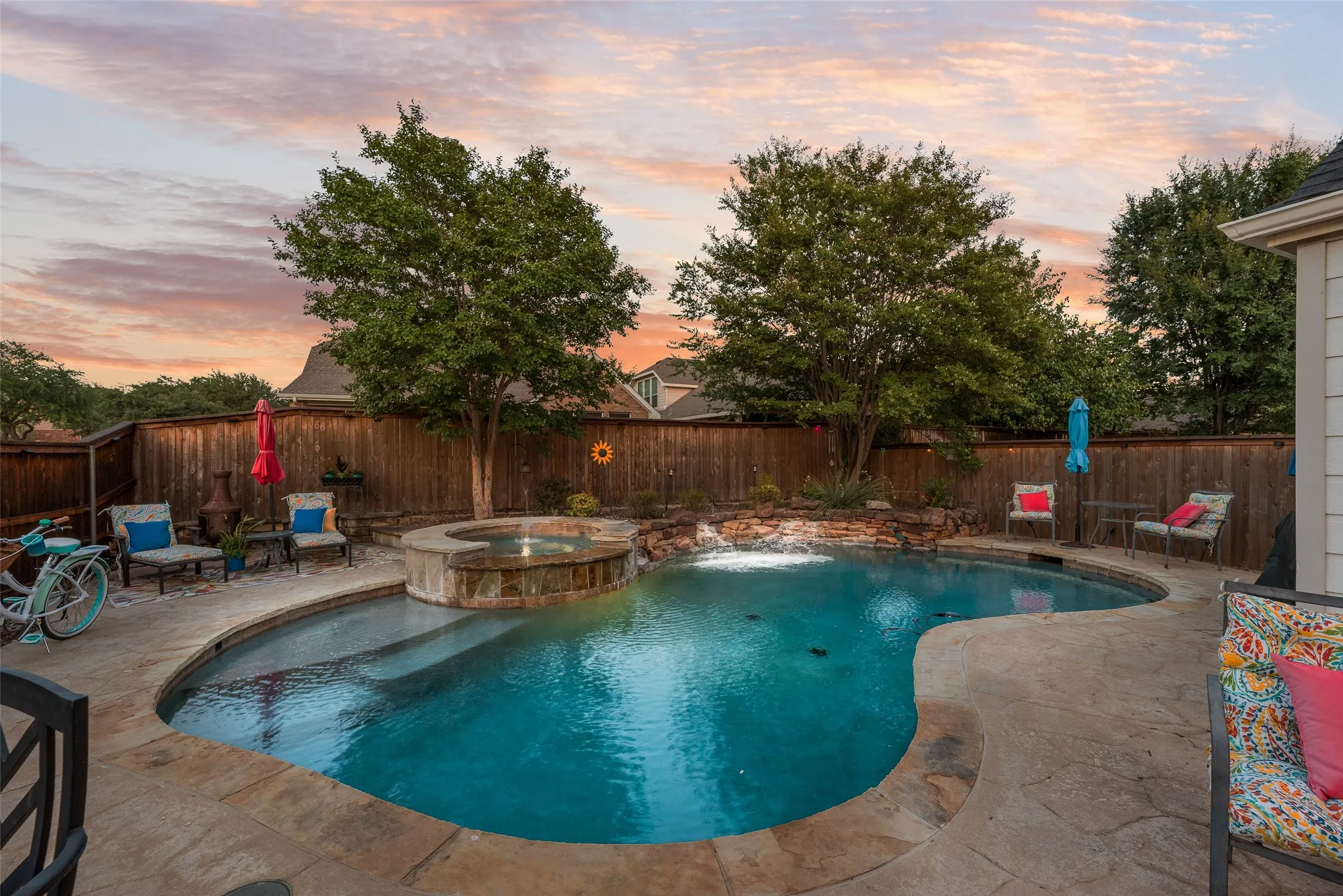 This in-ground gunite pool was built by Gohlke. Pretty landscaping surrounds the pool deck and the side gate allows your friends parking and easy access to your outdoor barbecue party!