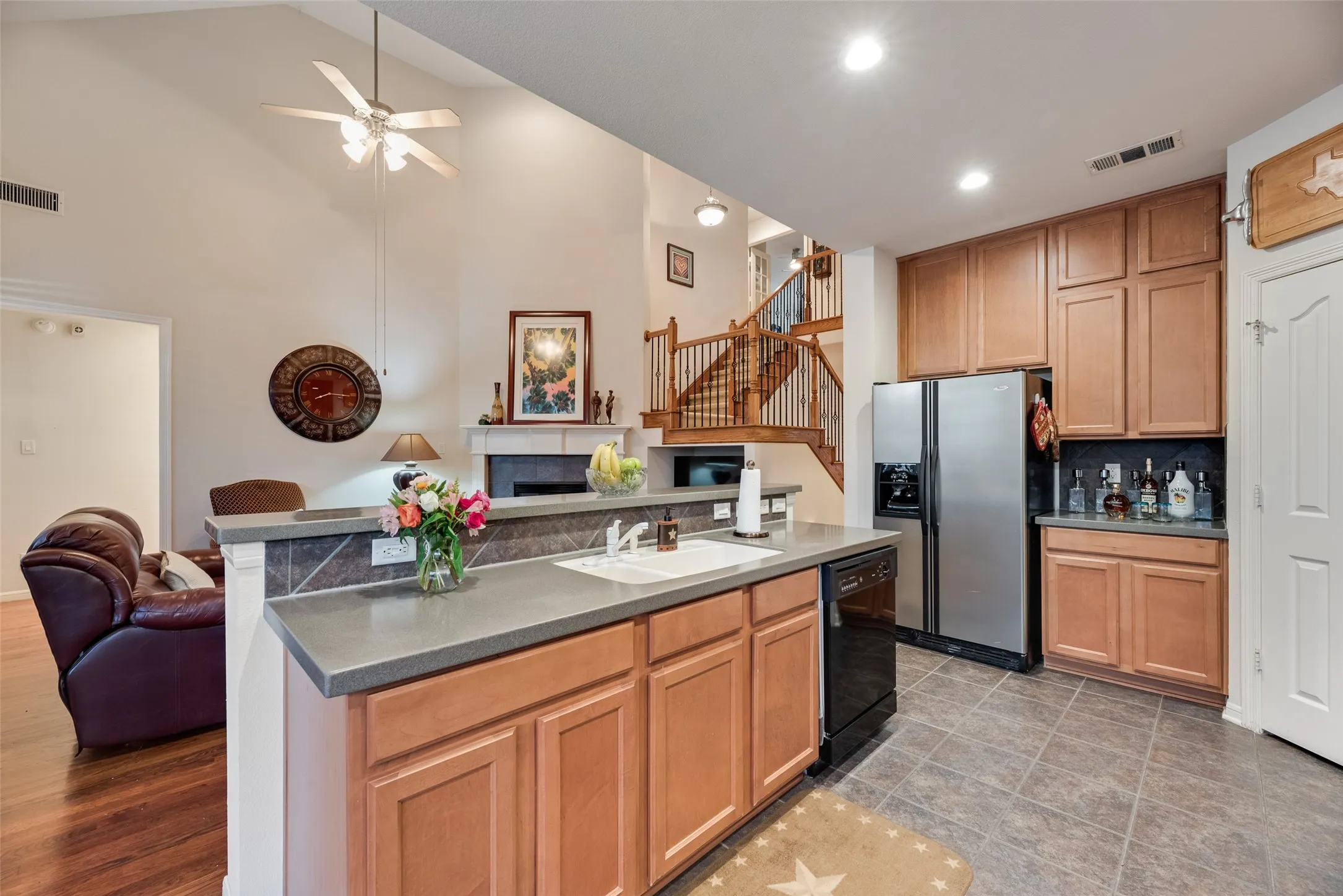 Spacious kitchen offers a walk-in pantry, generous counter, space, and an abundance of cabinets.