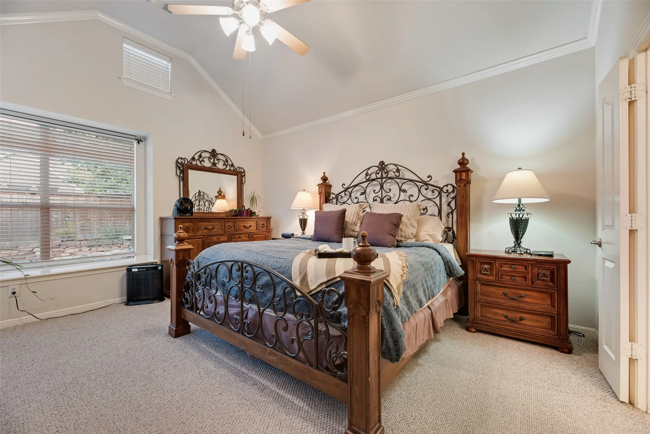 The primary bedroom is spacious enough for a sitting area and also offers a full corner of windows with picturesque views of the backyard and pool.