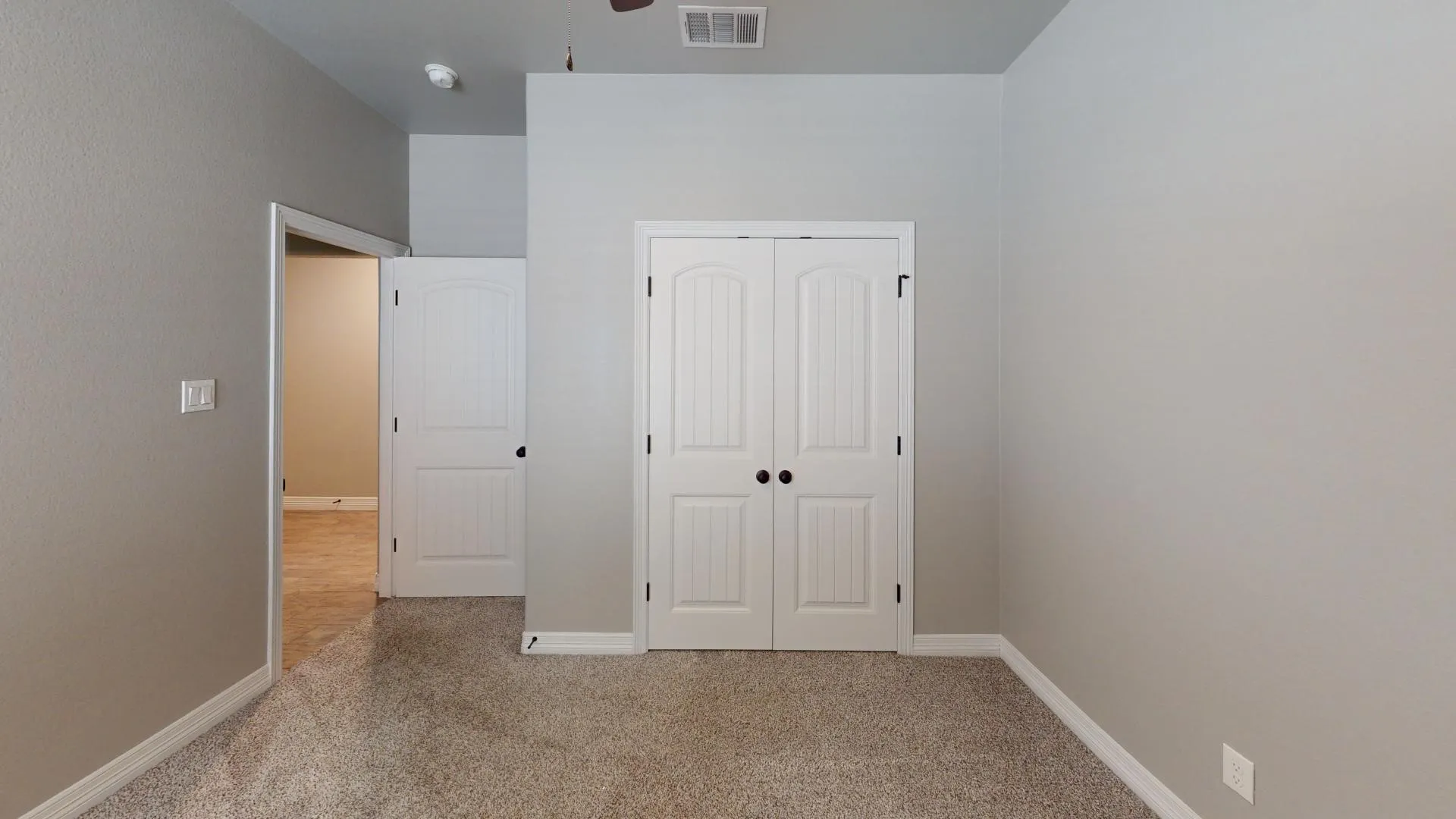 Bedroom 3 with neutral tone walls