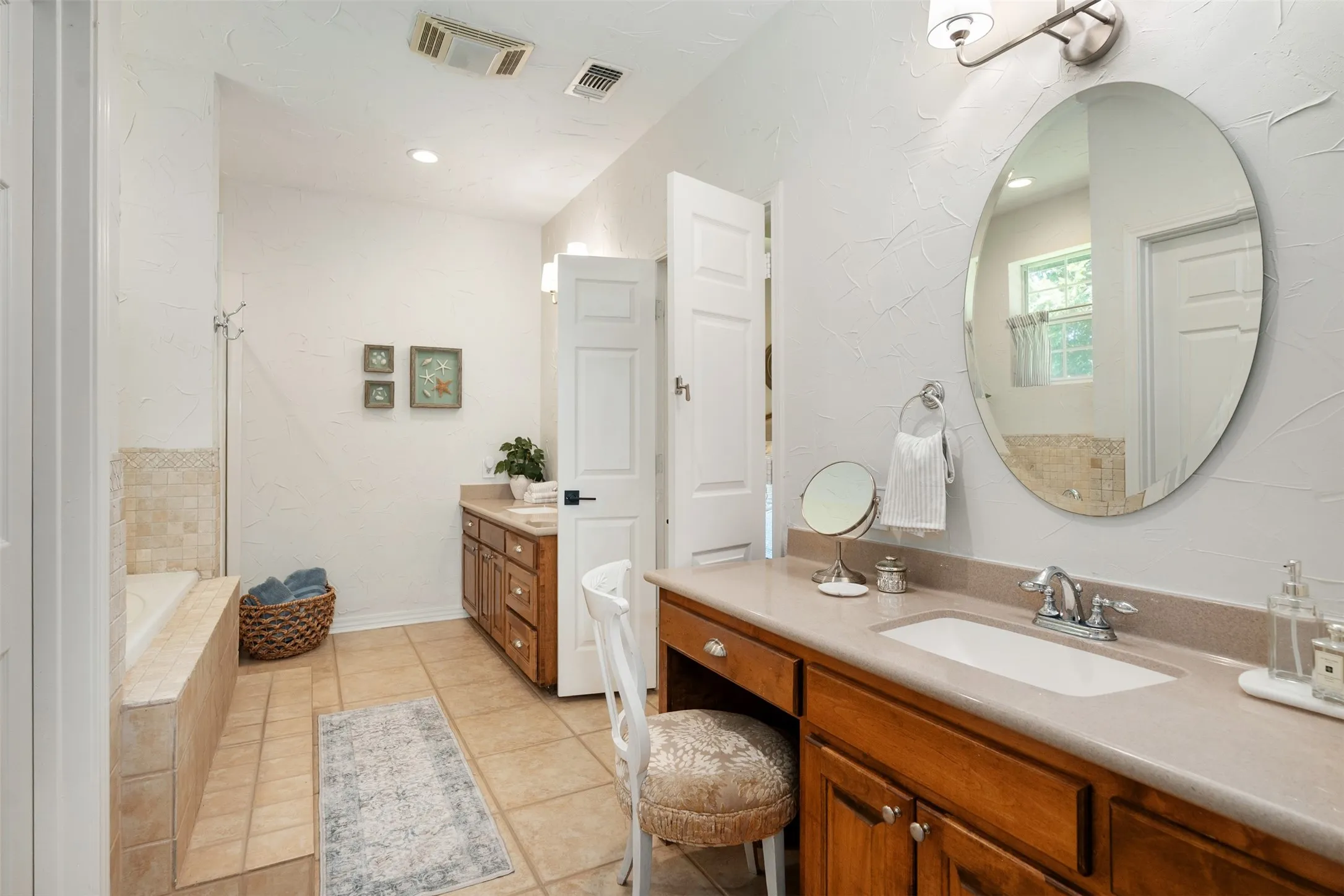 Primary bathroom with dual vanities
