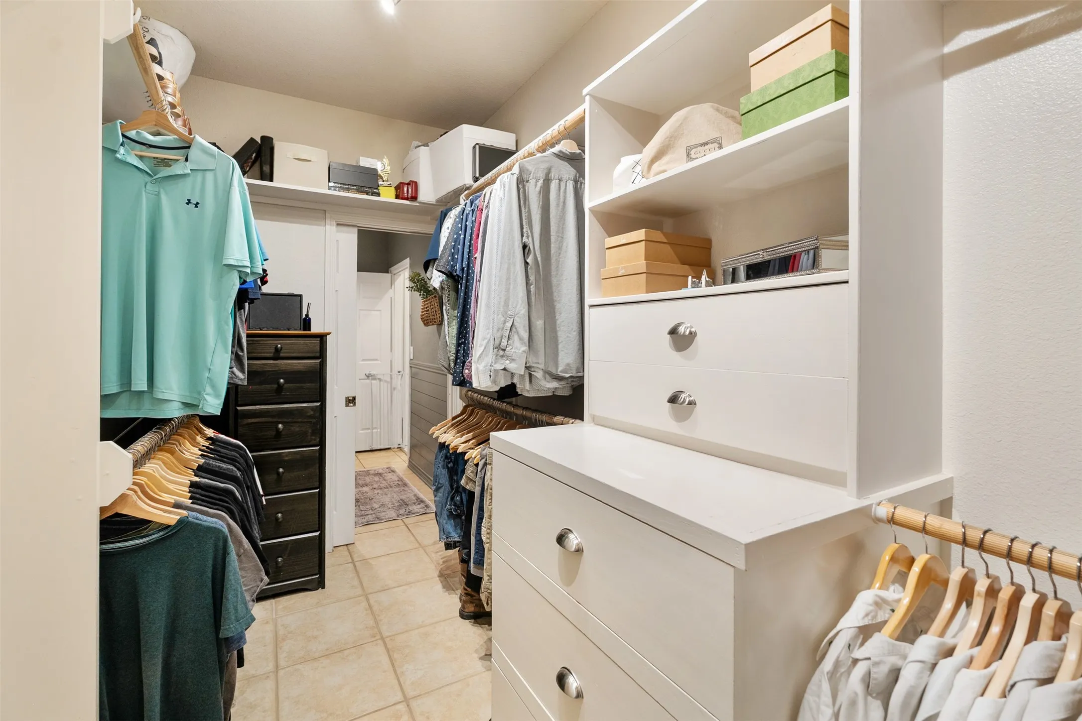 primary closet with built in storage