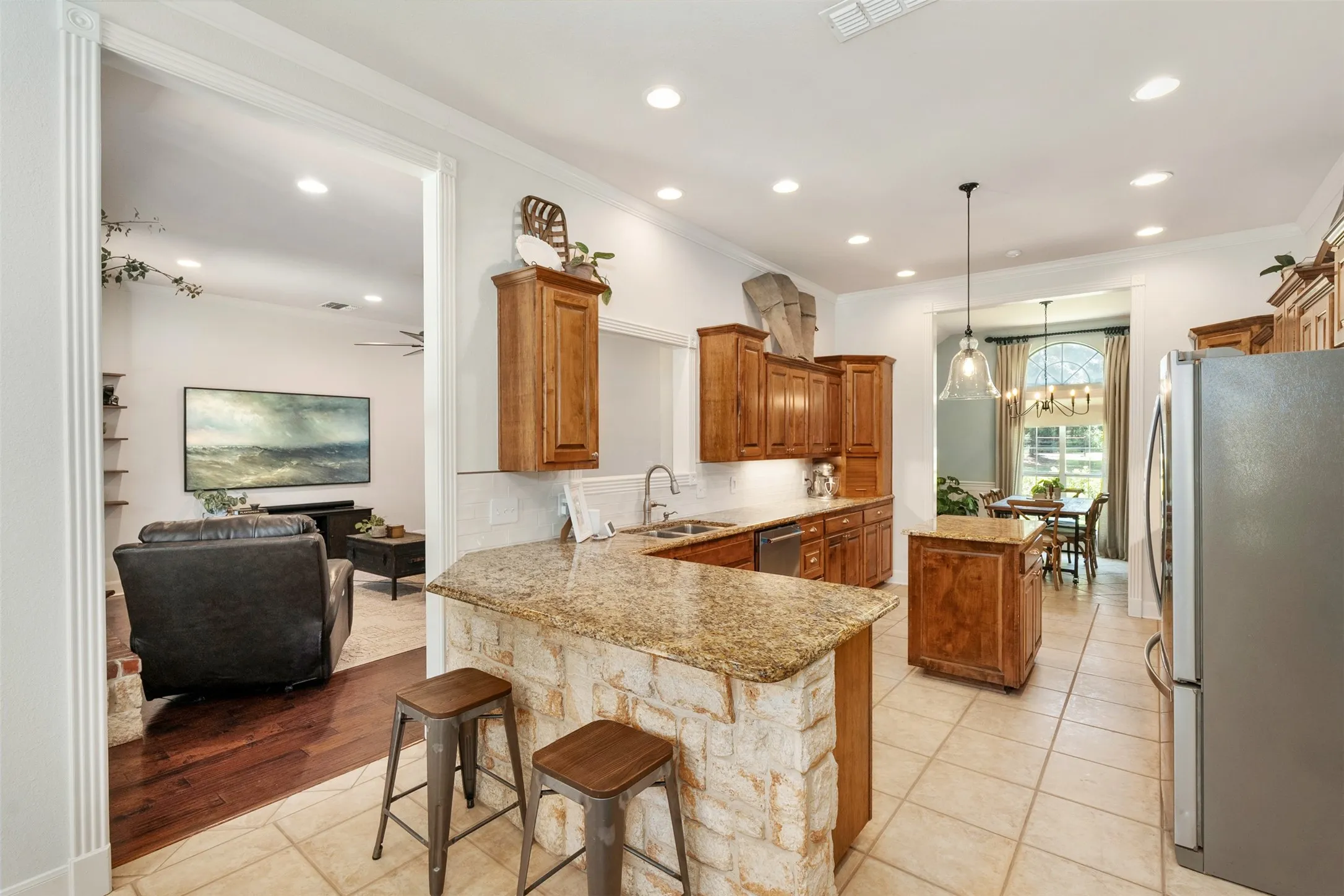 large kitchen connected to breakfast area and formal dining room