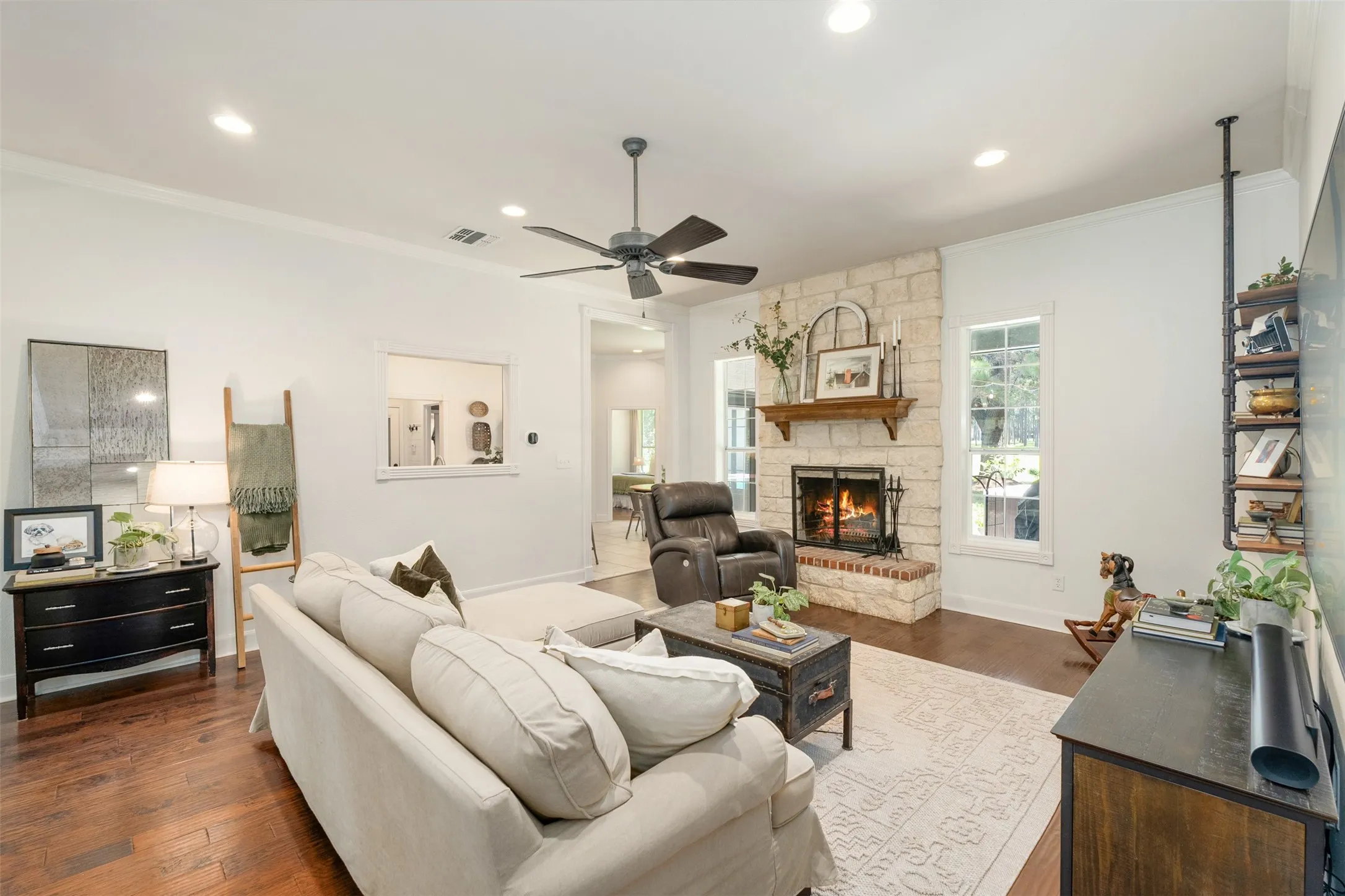 open living area with wood burning fireplace