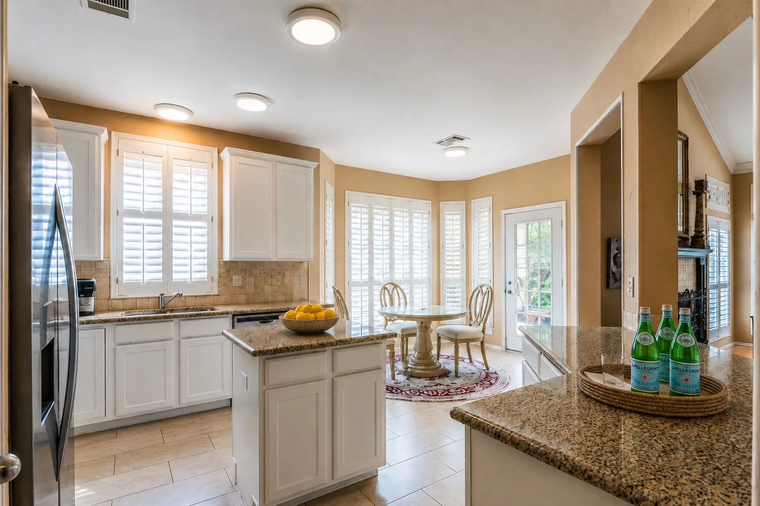 Bright white cabinets provide ample storage with stainless steel appliances