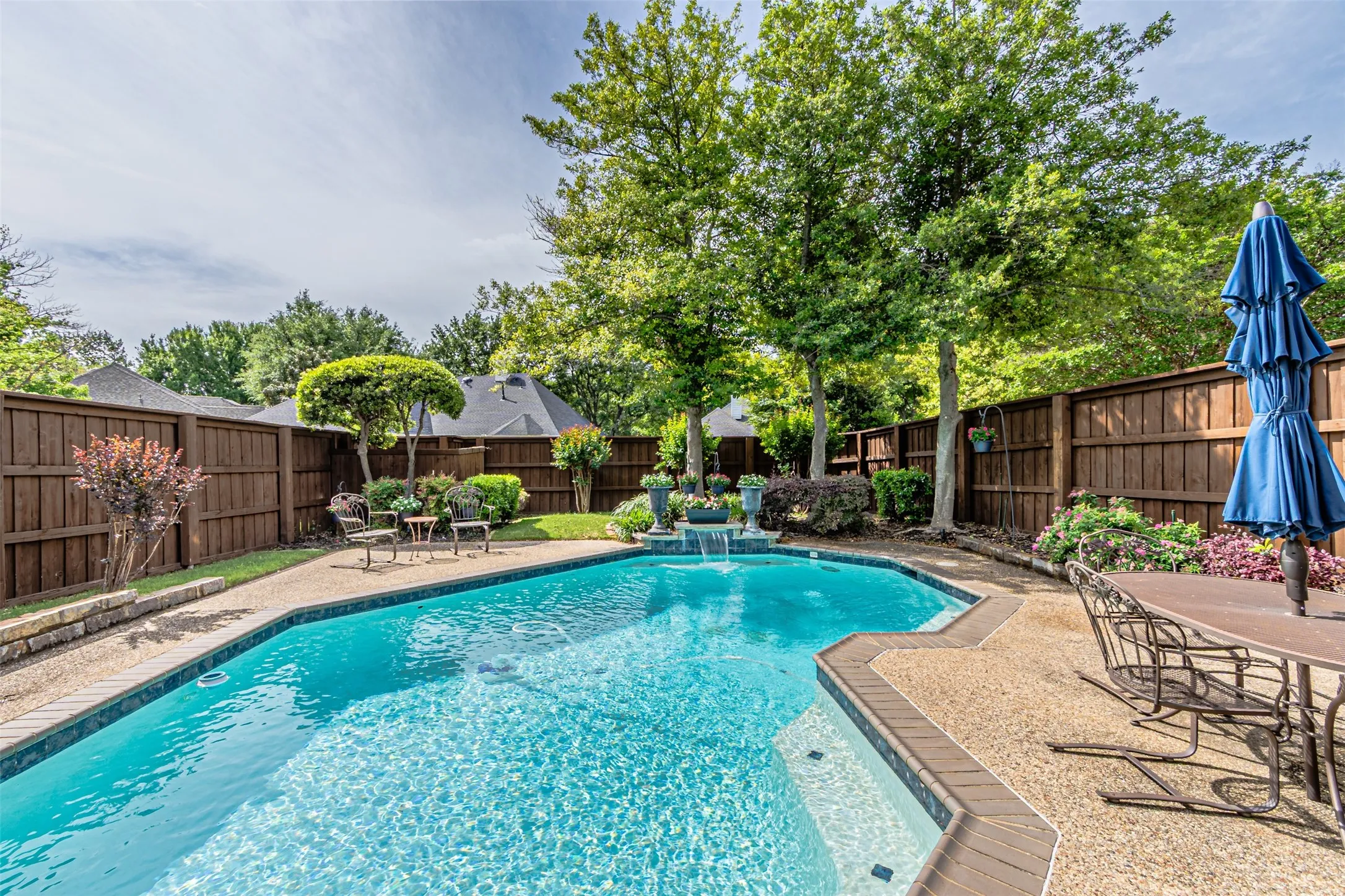 Nice large pool with a private backyard of mature trees and lush landscape