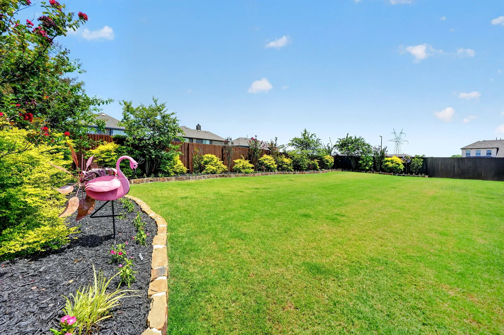 Extraordinary Flower Bed around Back Yard with Built-in Drip Watering System