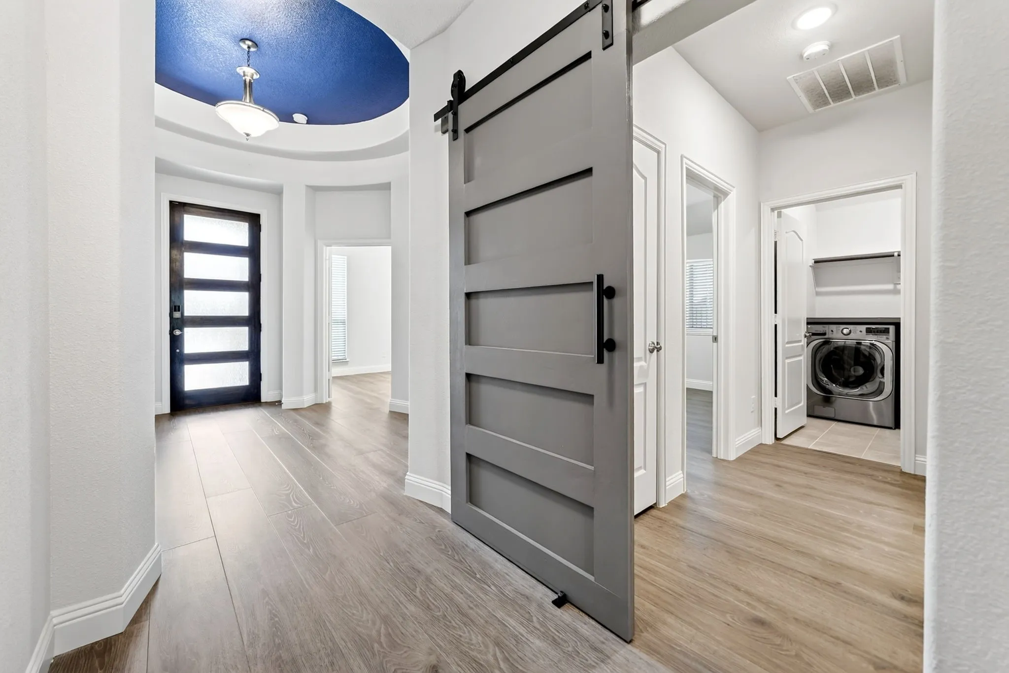 Rotunda Entry with Barn Door Leading to 2nd and 3rd Bedroom and full bath