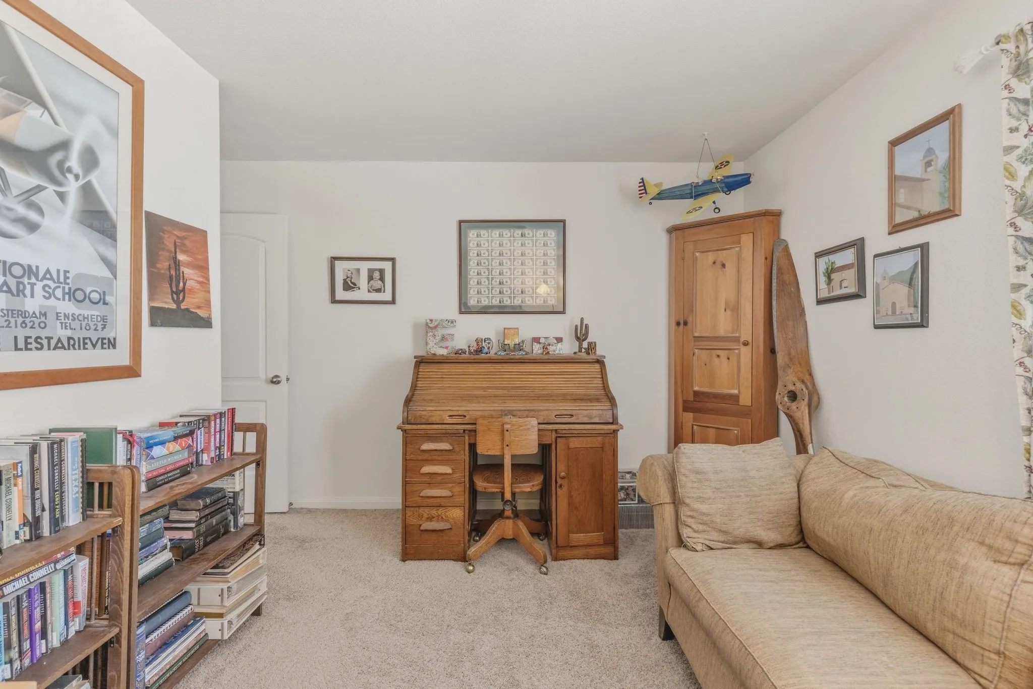 Carpeted room with white painted walls and a solid white interior door