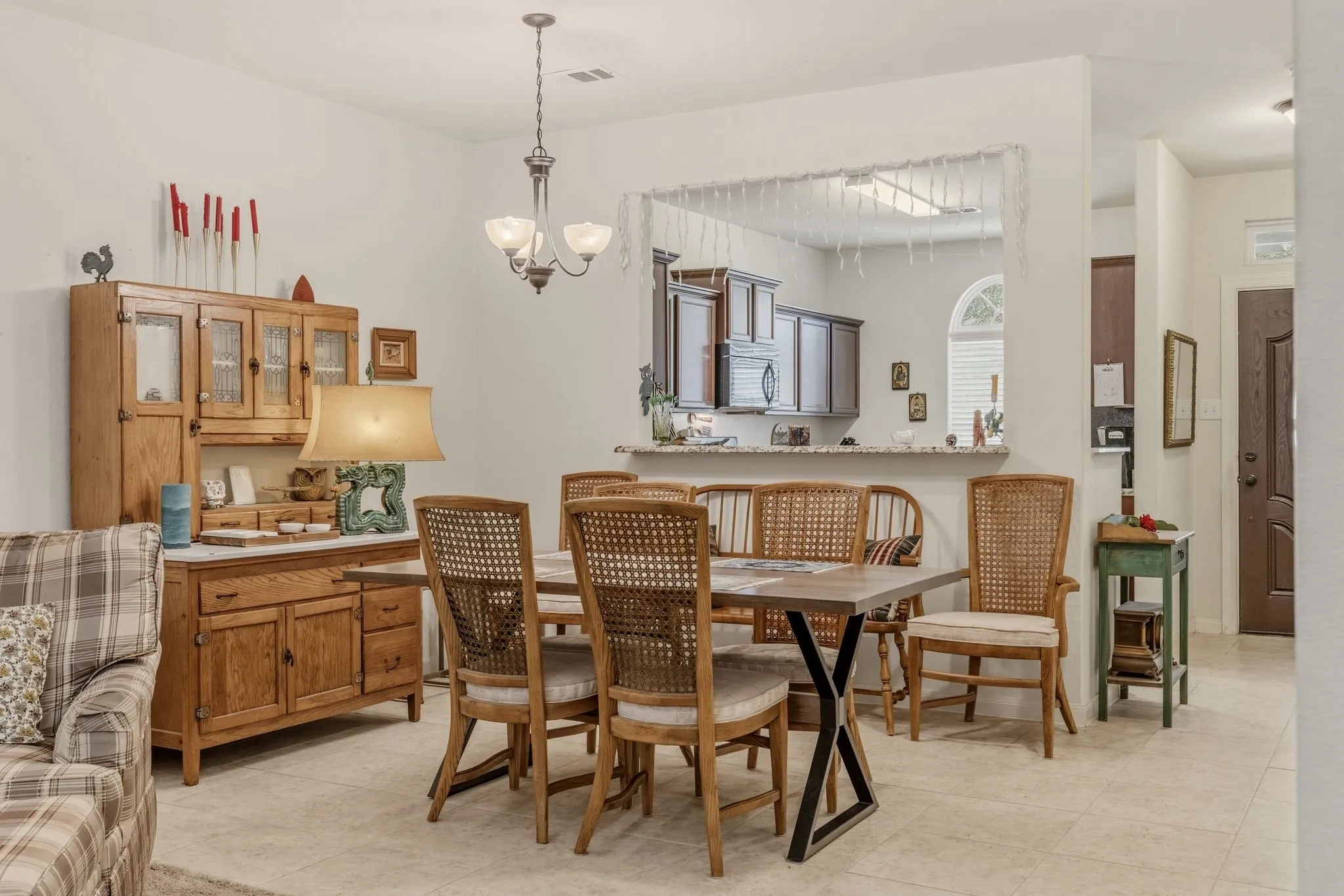 Open concept dining area featuring neutral wall paint and tile flooring
