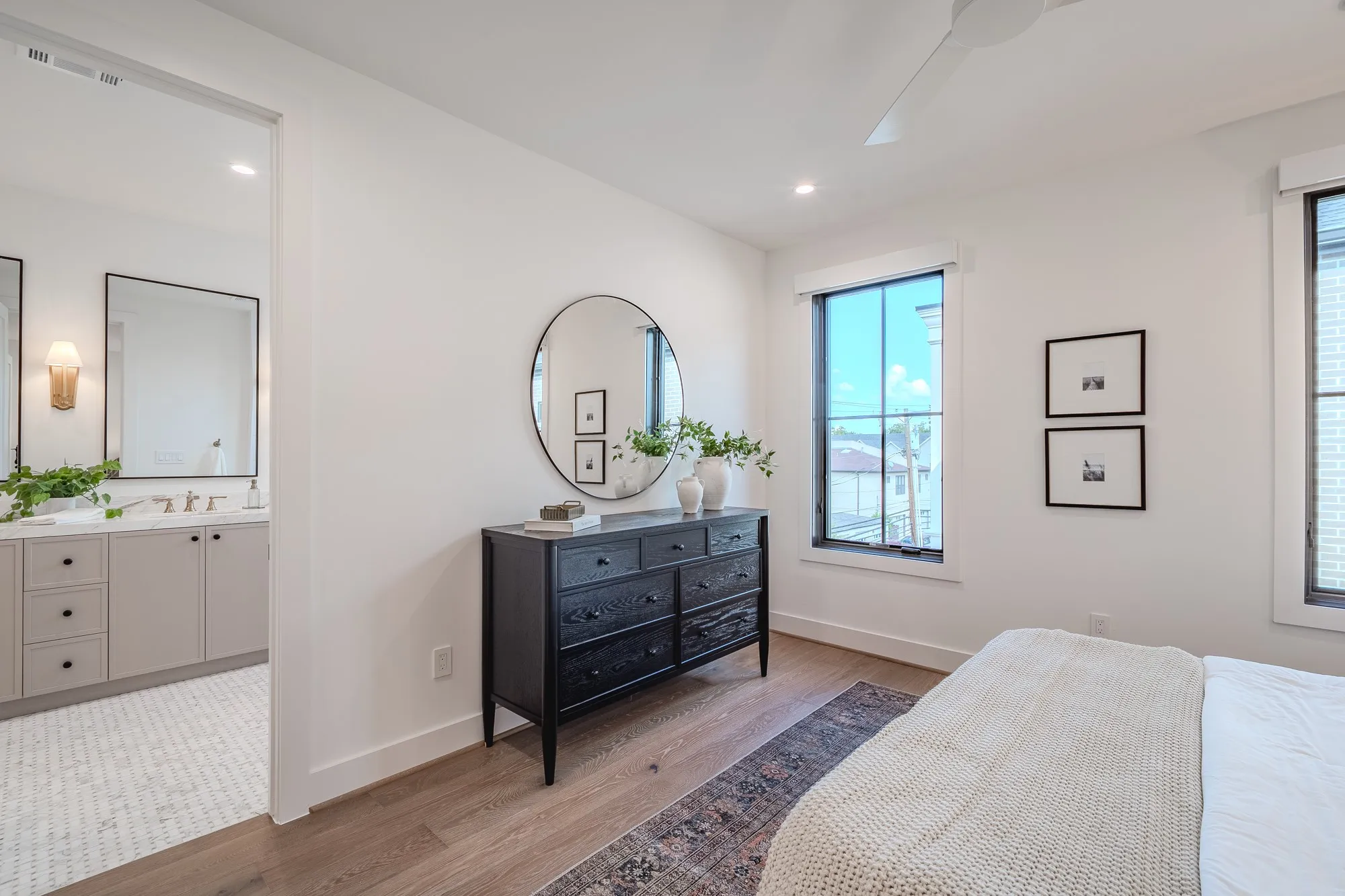 Bedroom with light wood-style flooring, ceiling fan, and recessed lighting