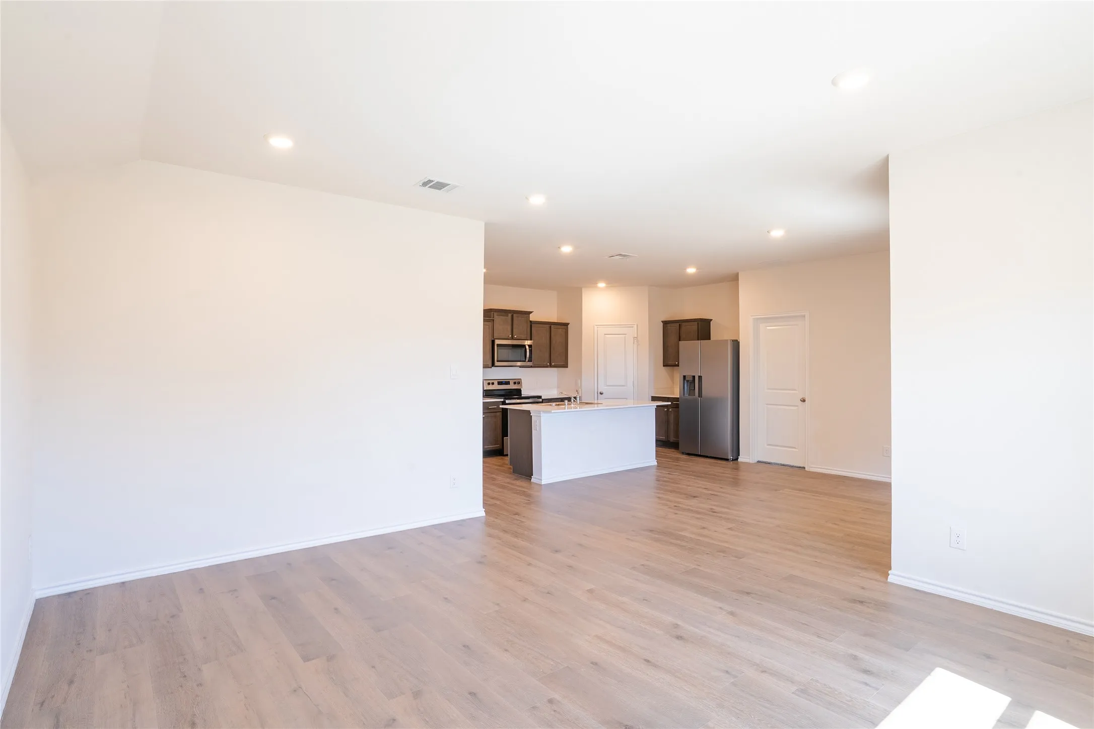 Living room view of dining area and kitchen