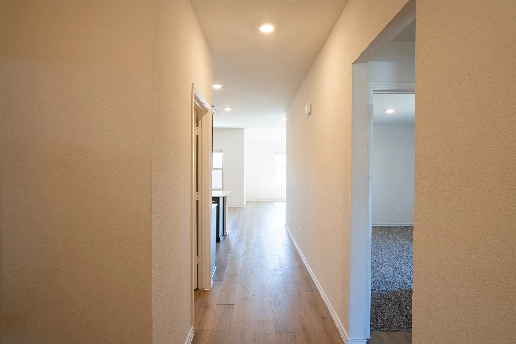 Front hall with bedrooms on right and laundry utility room on left.