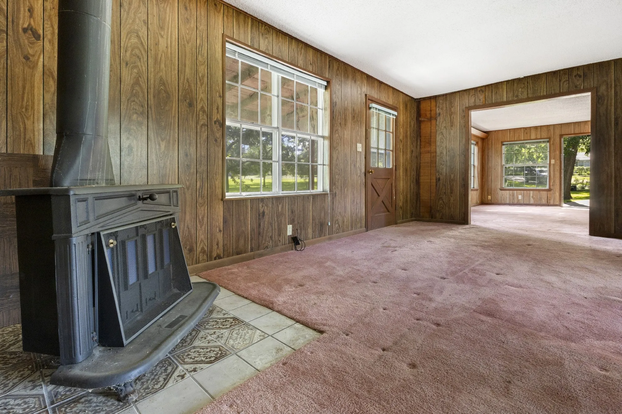 Front door of ADU, Living Room and stove.